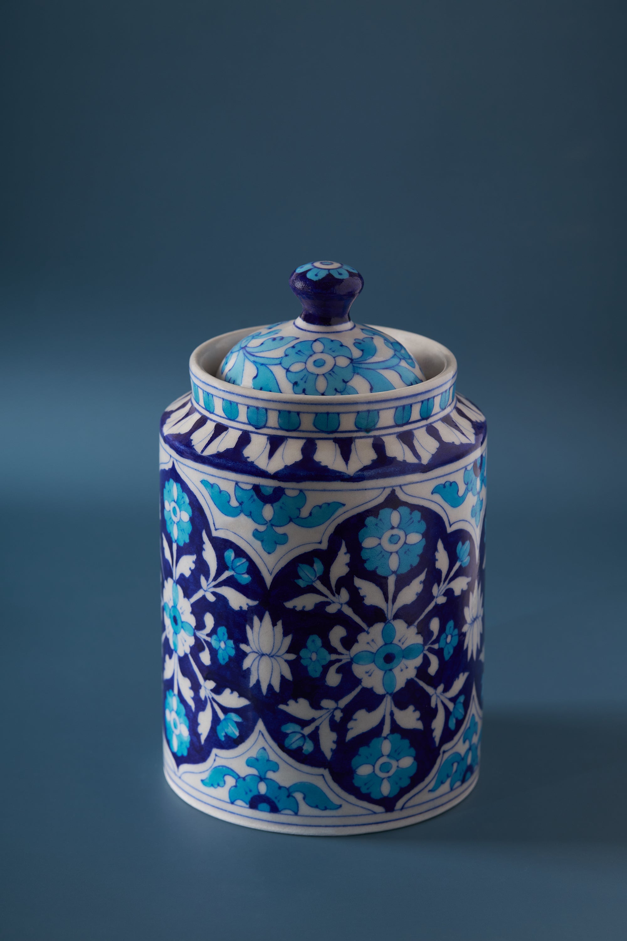 Hand-Painted Blue Ceramic Canister – Elegant Storage Jar
A beautifully handcrafted blue ceramic canister with intricate floral patterns, perfect for storing coffee, tea, or spices