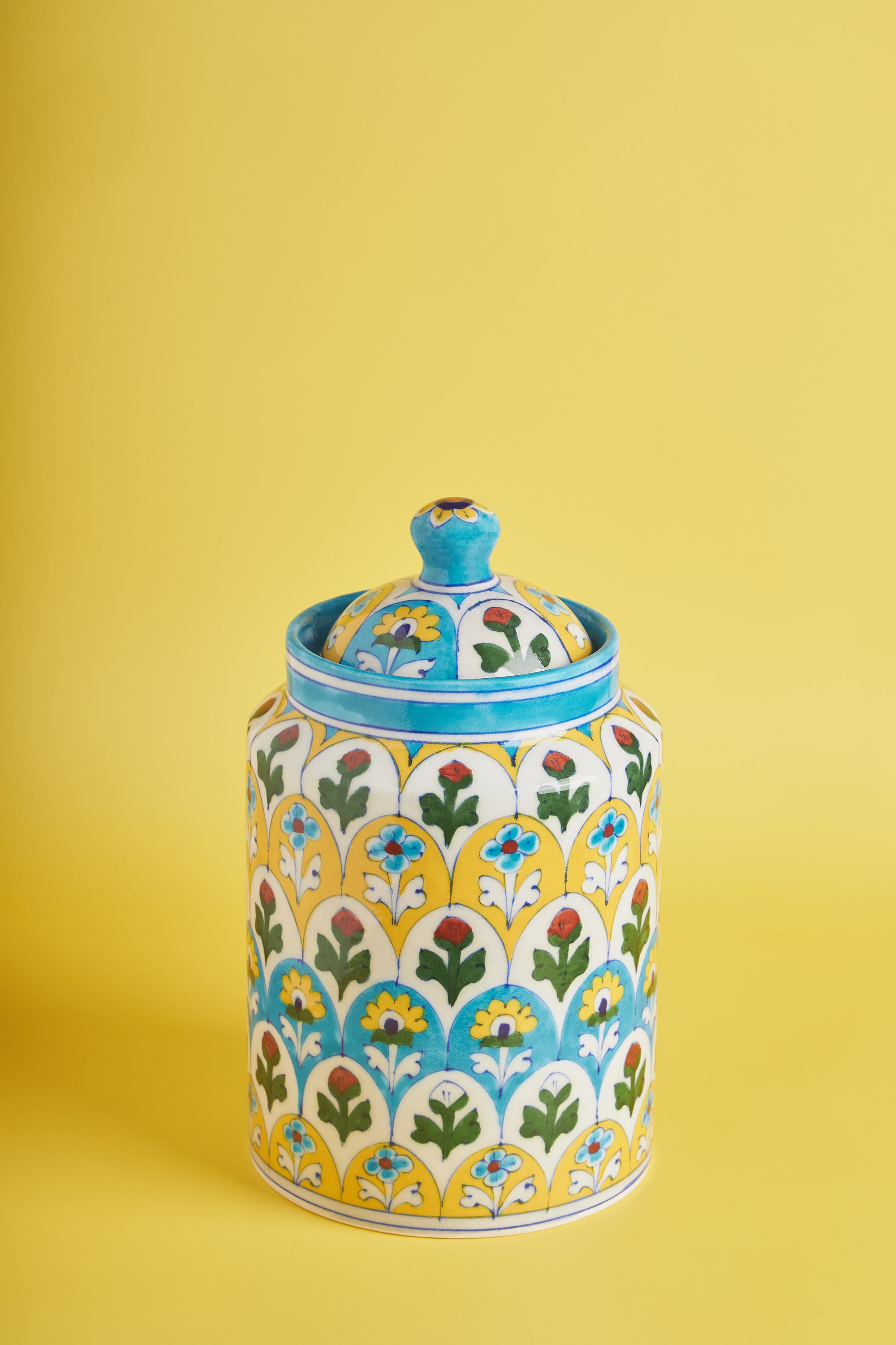 Hand-crafted blue-pottery kitchen canister with hand-painted floral motifs — artisan luxury storage piece