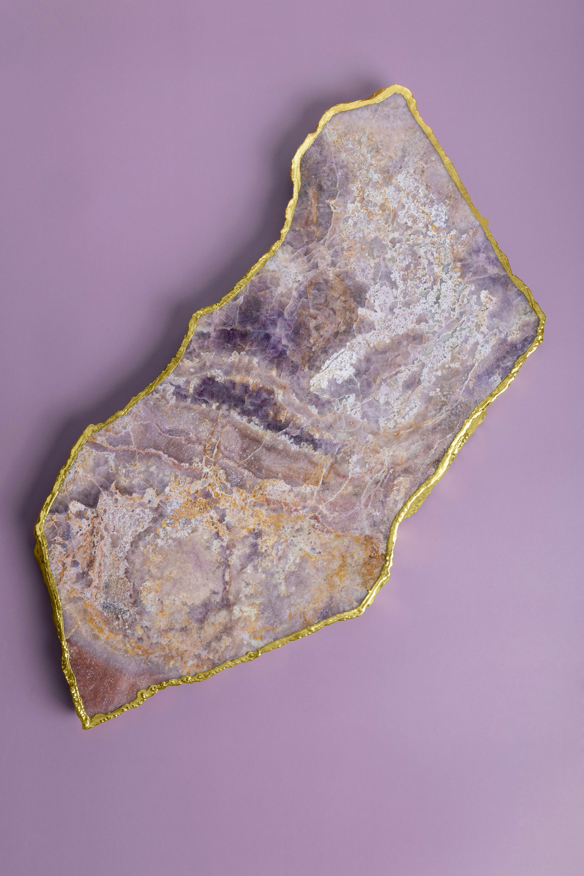 Handcrafted semi-precious stone cheese board with rich color and gold trim — artisan luxury serve piece