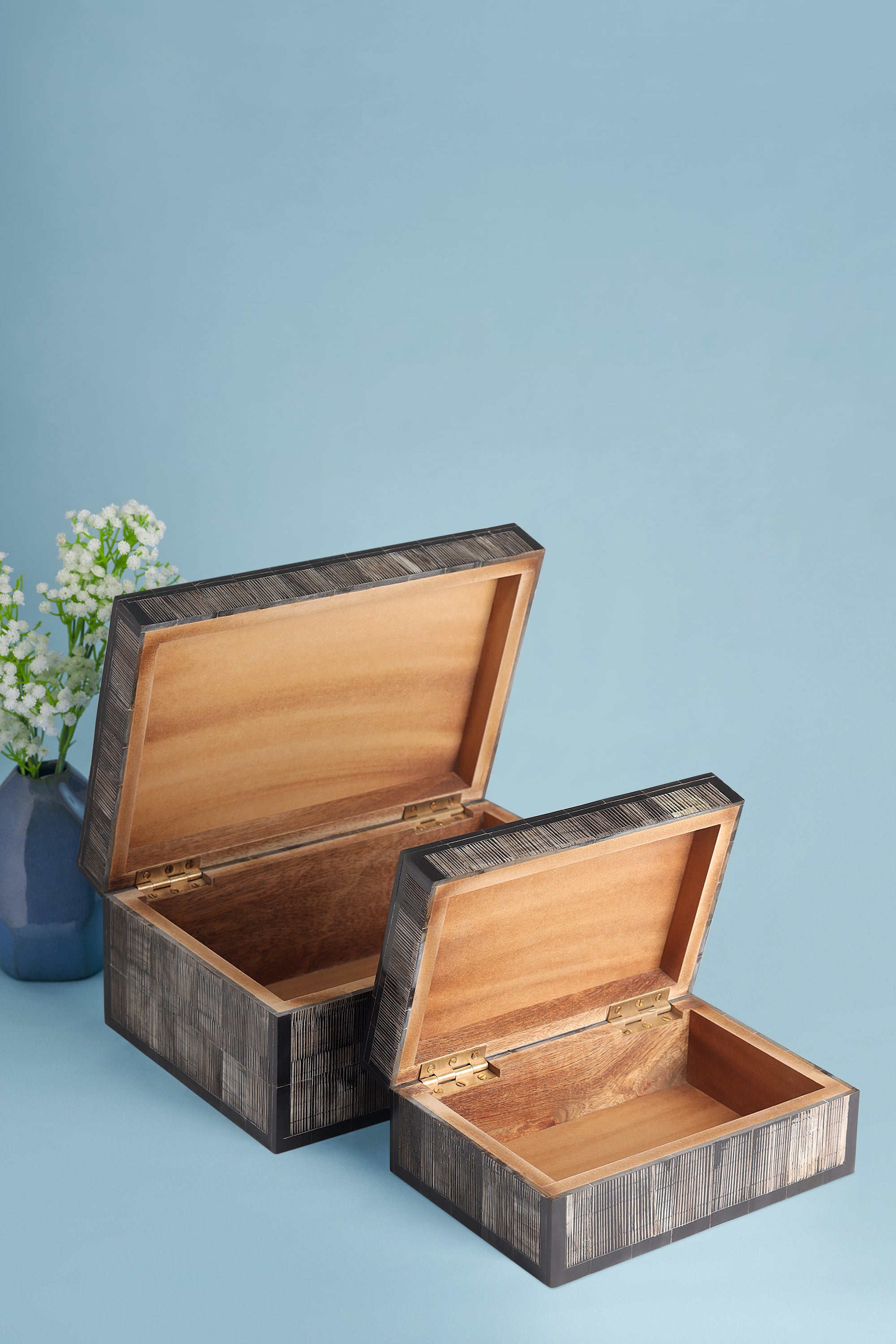 Artisan-made decorative boxes in natural horn with smooth finish and subtle texture — luxury home layer