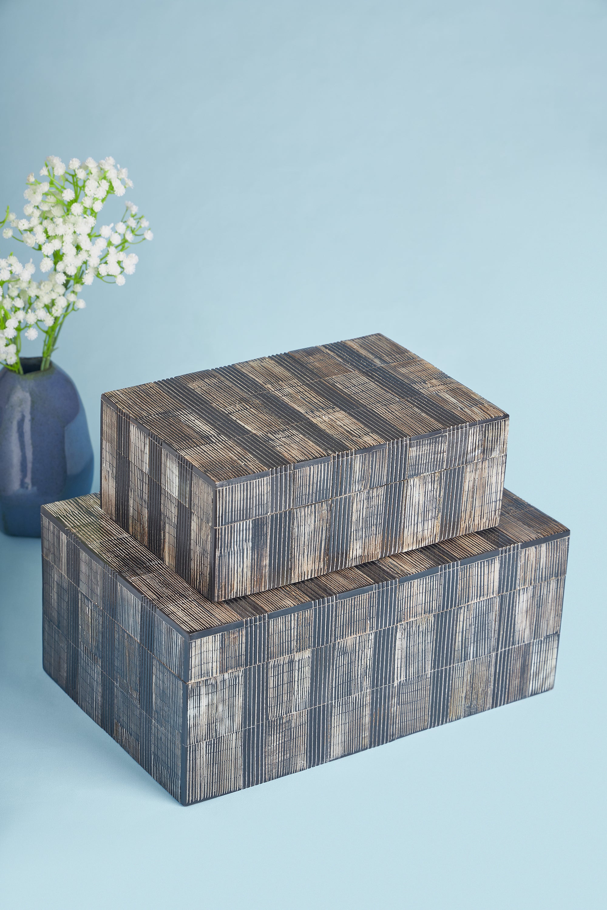 Handcrafted decorative boxes made from natural horn in rich brown and ivory tones — artisan luxury accent