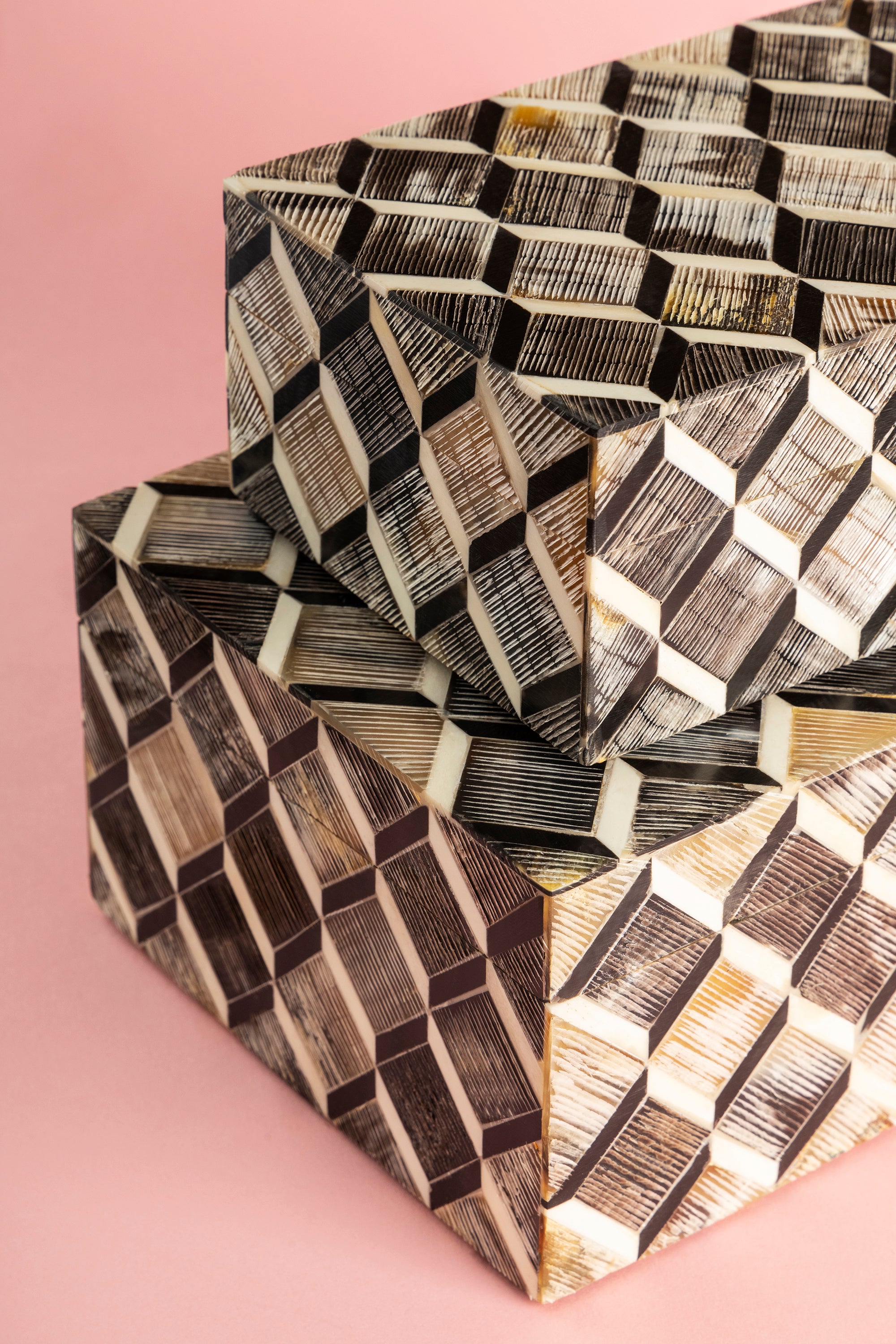 Artisan-made storage boxes with natural horn and bone pattern and warm finish — luxury home layer