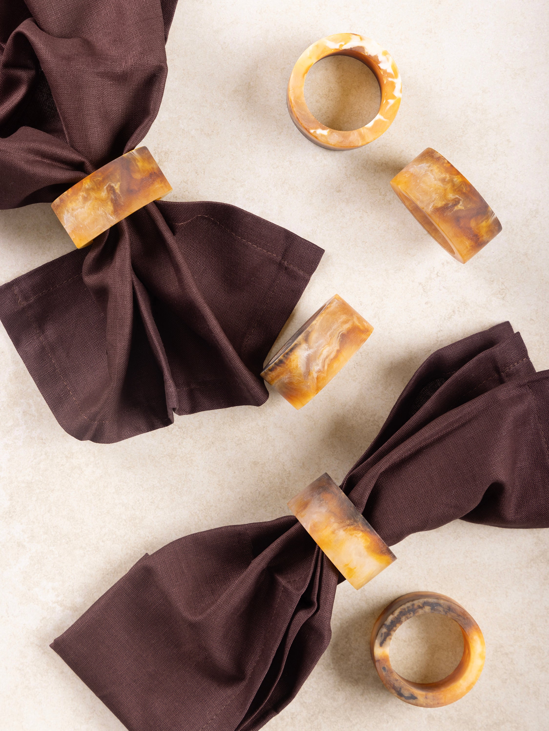 Elegant brown resin napkin rings set for a sophisticated dining table