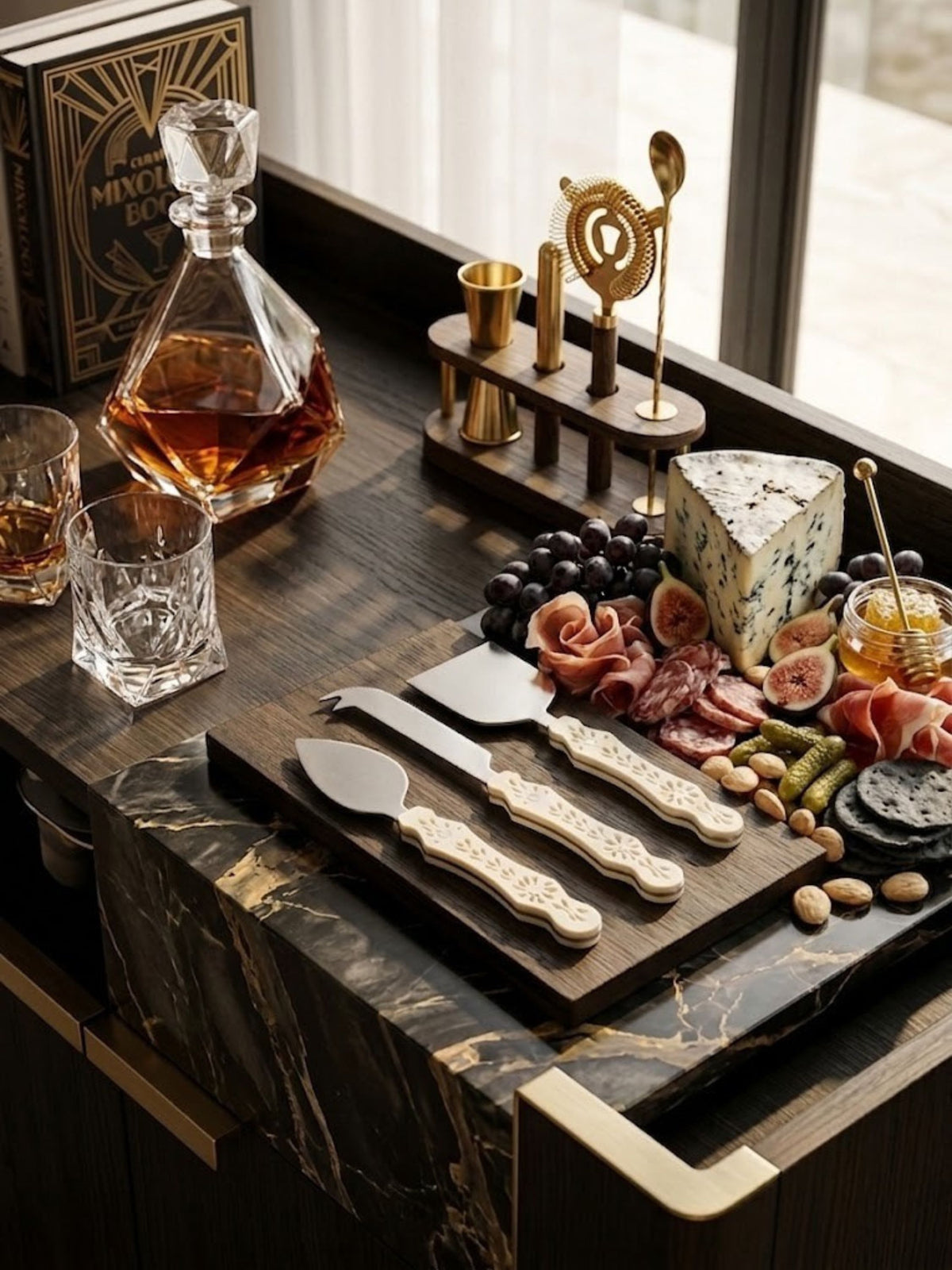 Ivory carved resin cheese knives, leaf-shaped blade detail, shown on a bar cart.