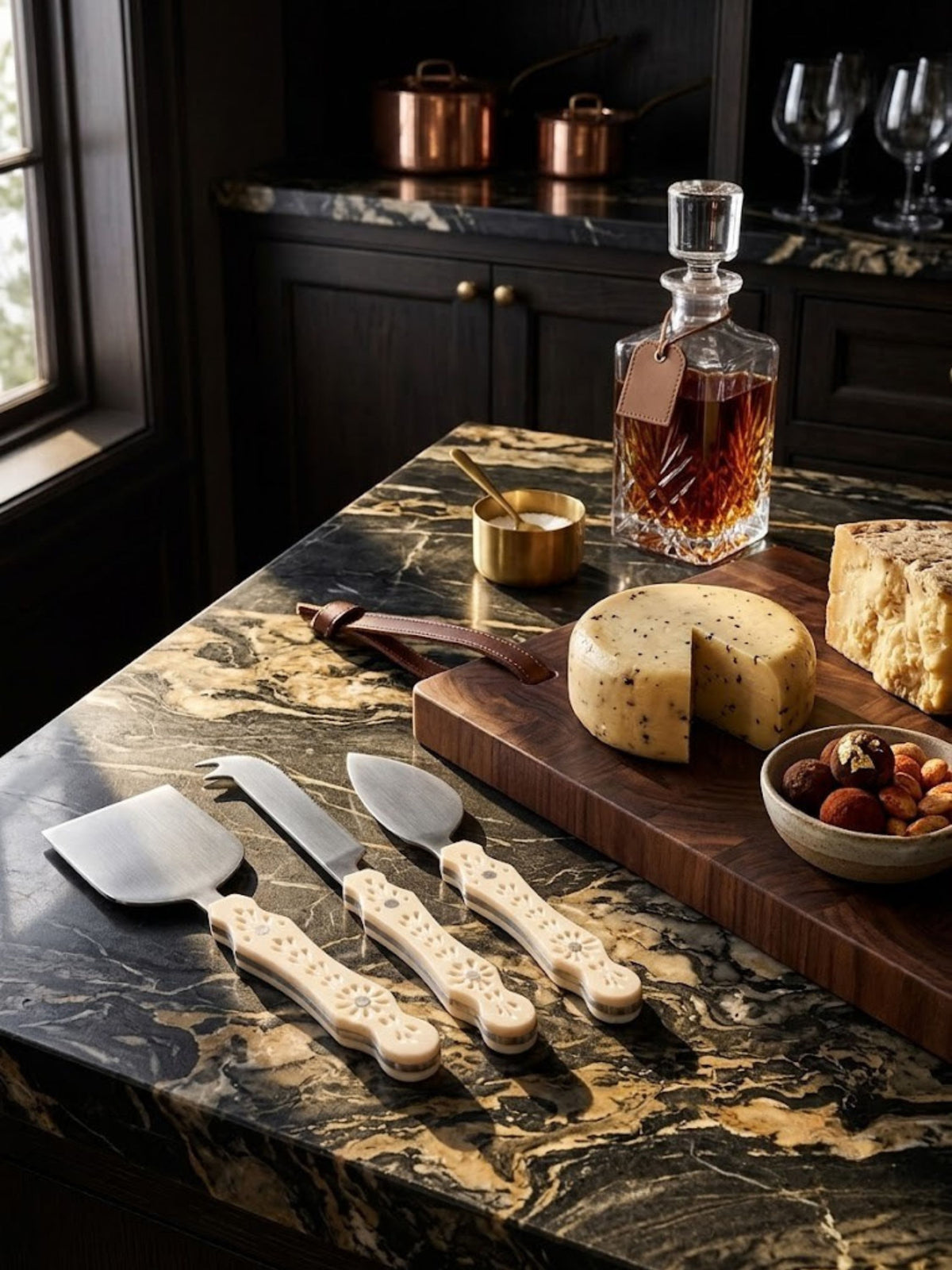 Ivory carved resin cheese knives with pierced botanical handles, shown at a home bar setting.