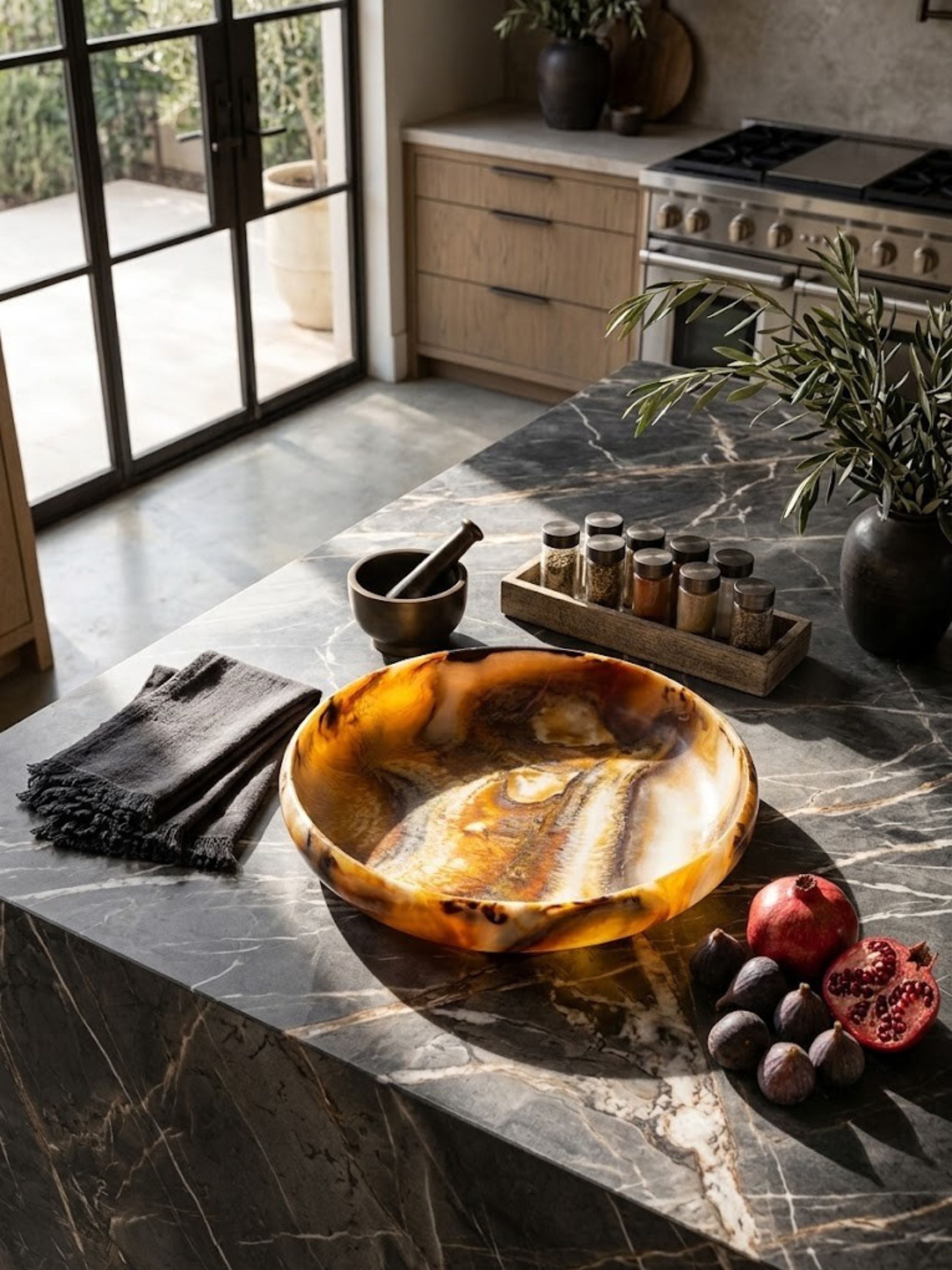 Marbled resin bowl with rounded walls, amber and brown tones, styled on a kitchen counter.