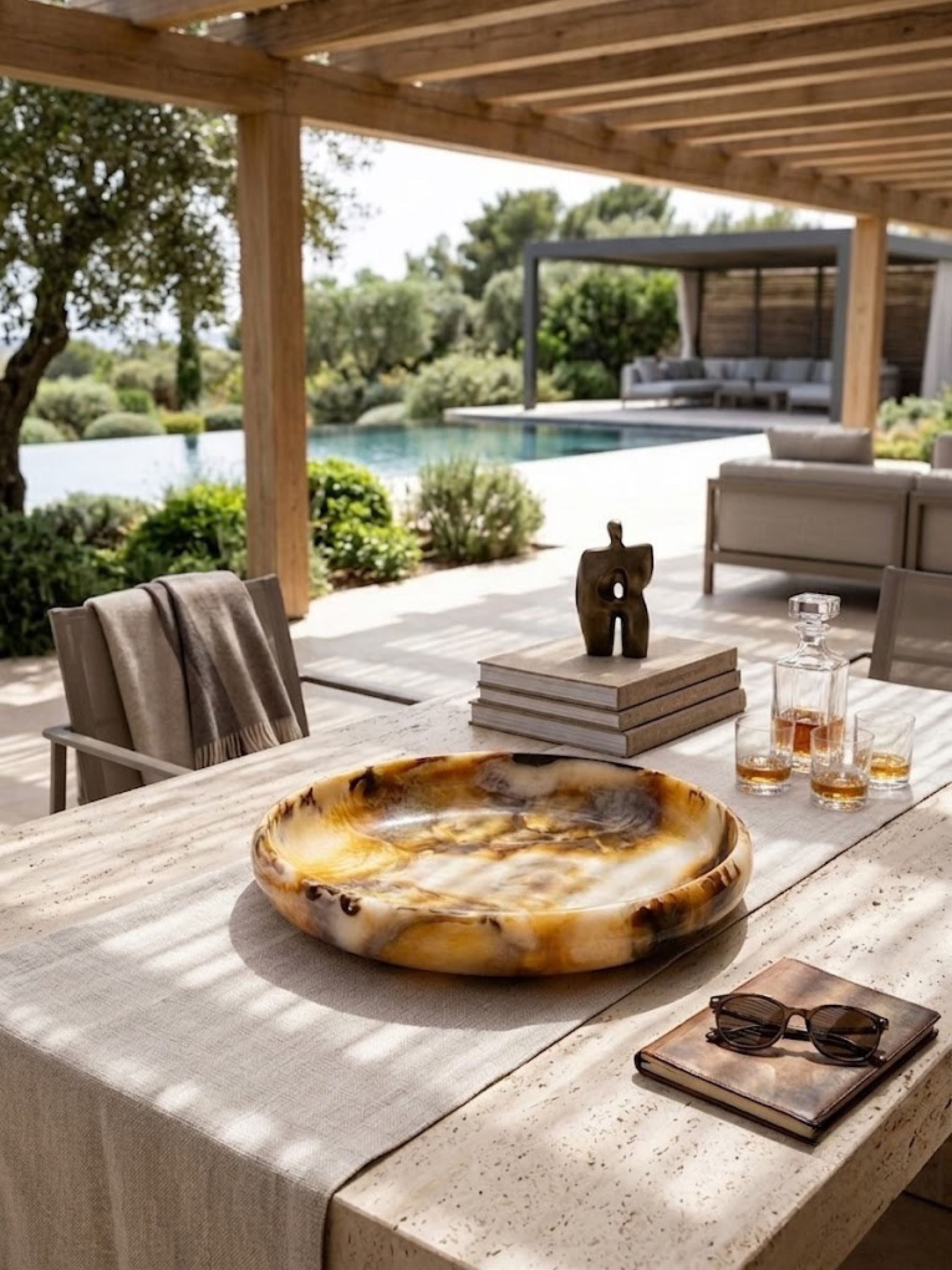 Wide marbled resin bowl with a continuous rounded rim, amber and brown tones blending across the surface.