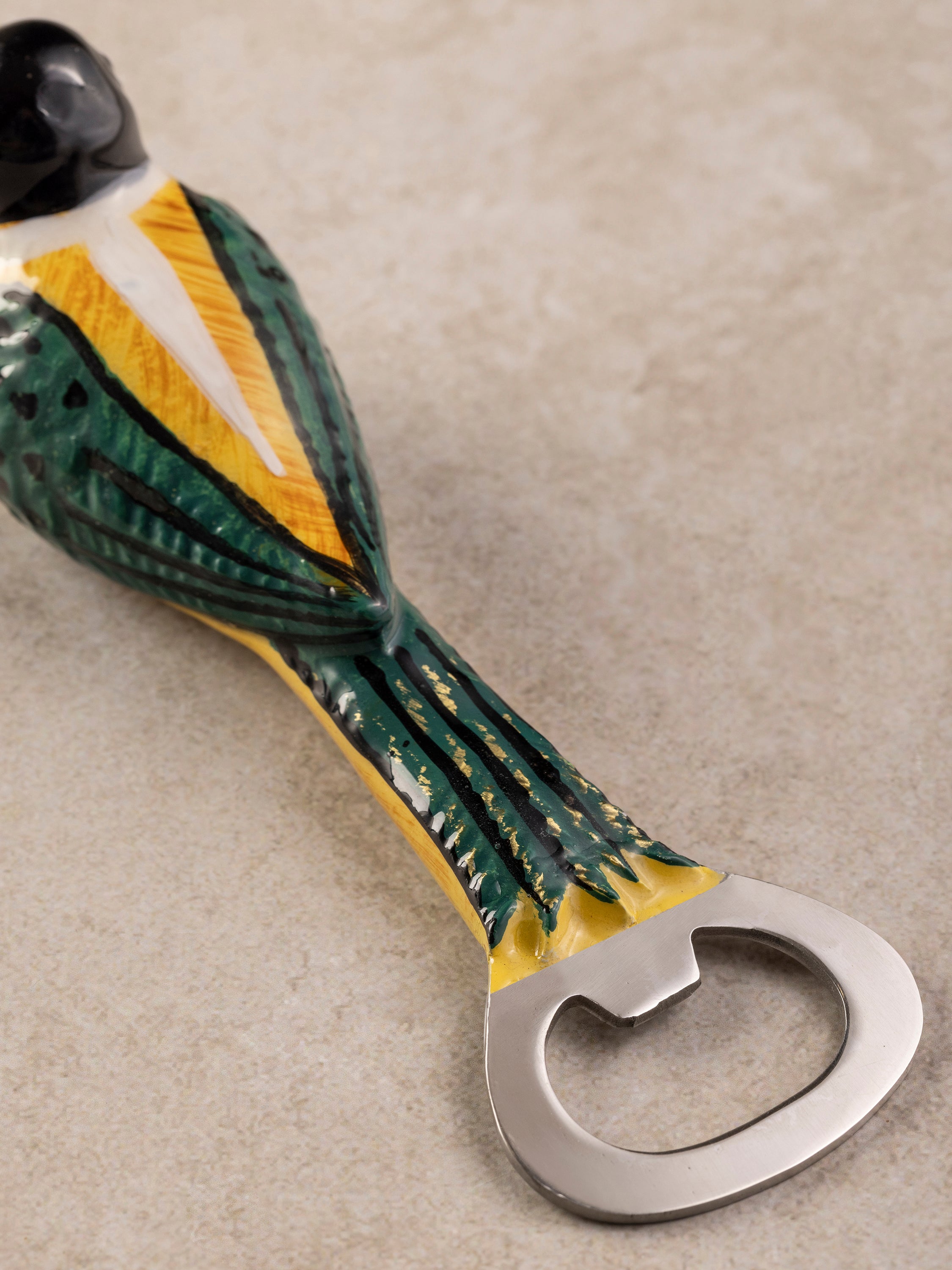 Magpie bottle opener showing its sculptural bird form and elongated body, presented in a clean composition.