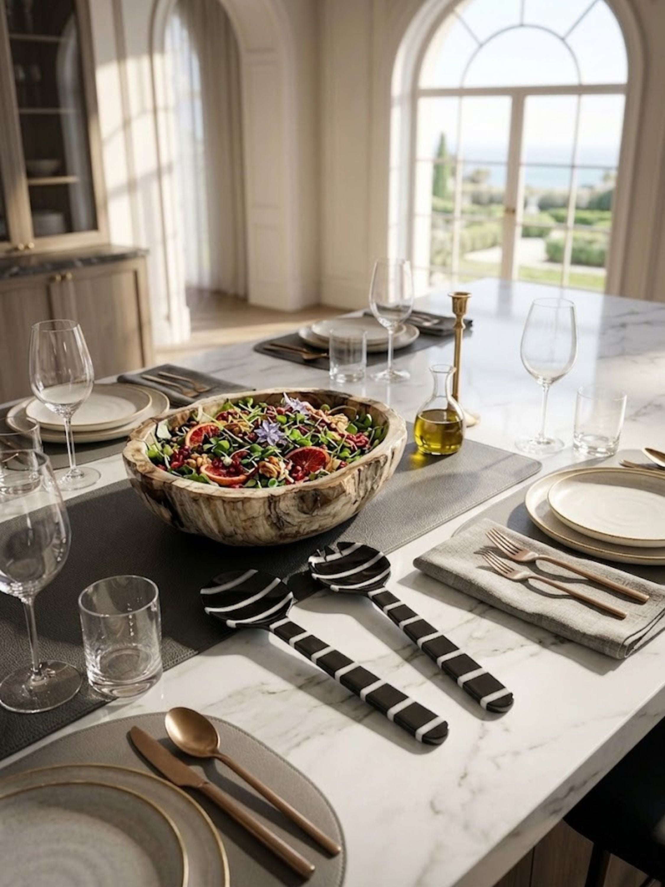 Cox resin salad servers presented alongside a handcrafted serving bowl on a refined dining table, adding sculptural character to everyday meals and special occasions.