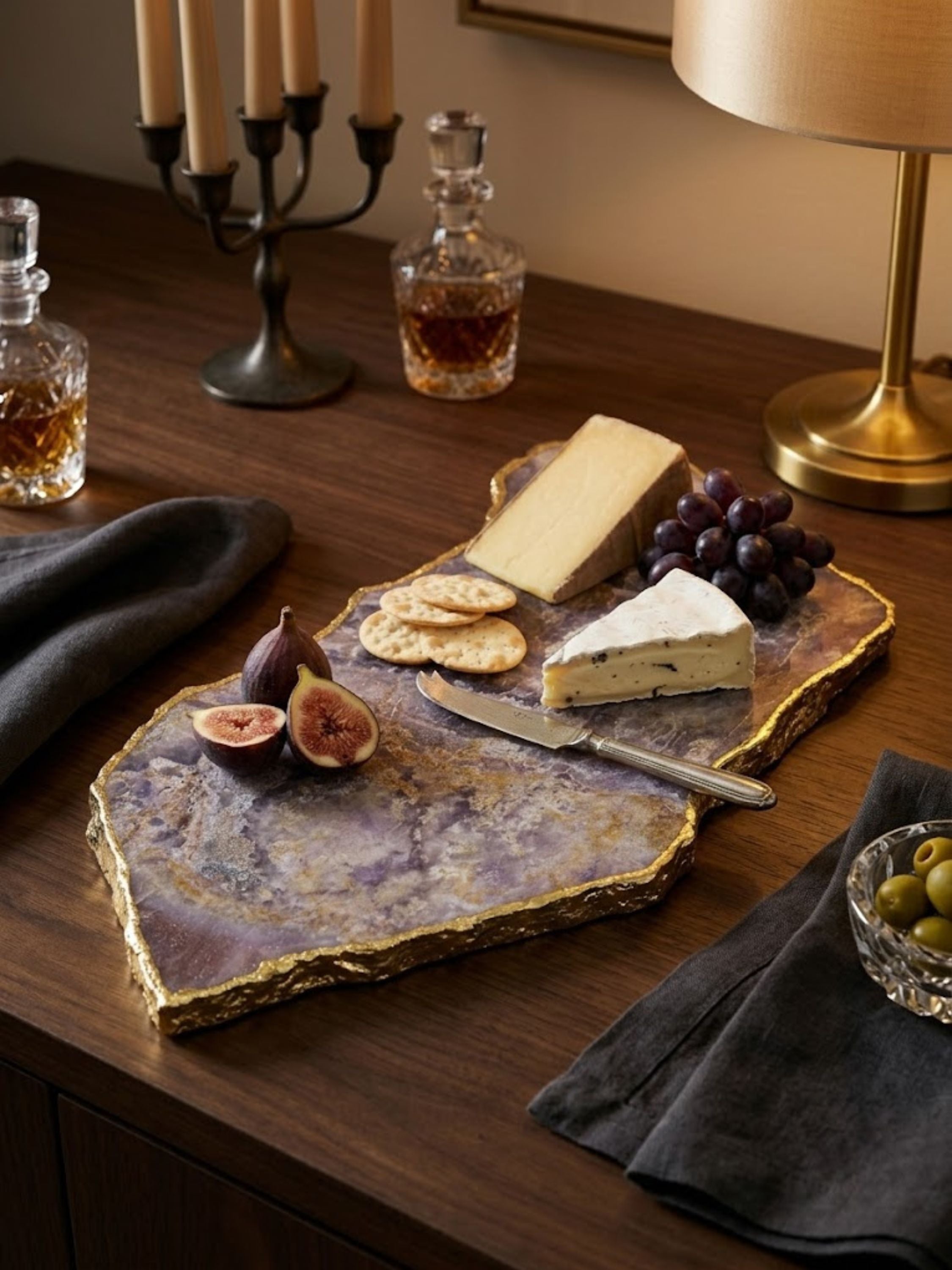 Deep violet amethyst stone cheese board styled on a home bar.