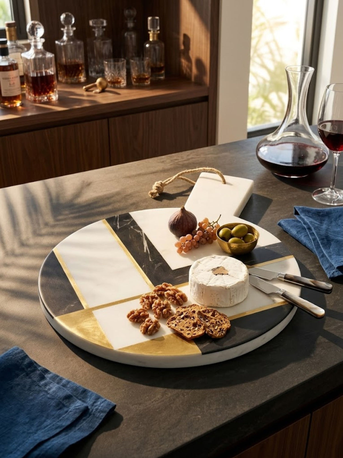 White and charcoal marble cheese board with a charcoal border, styled on a home bar counter.