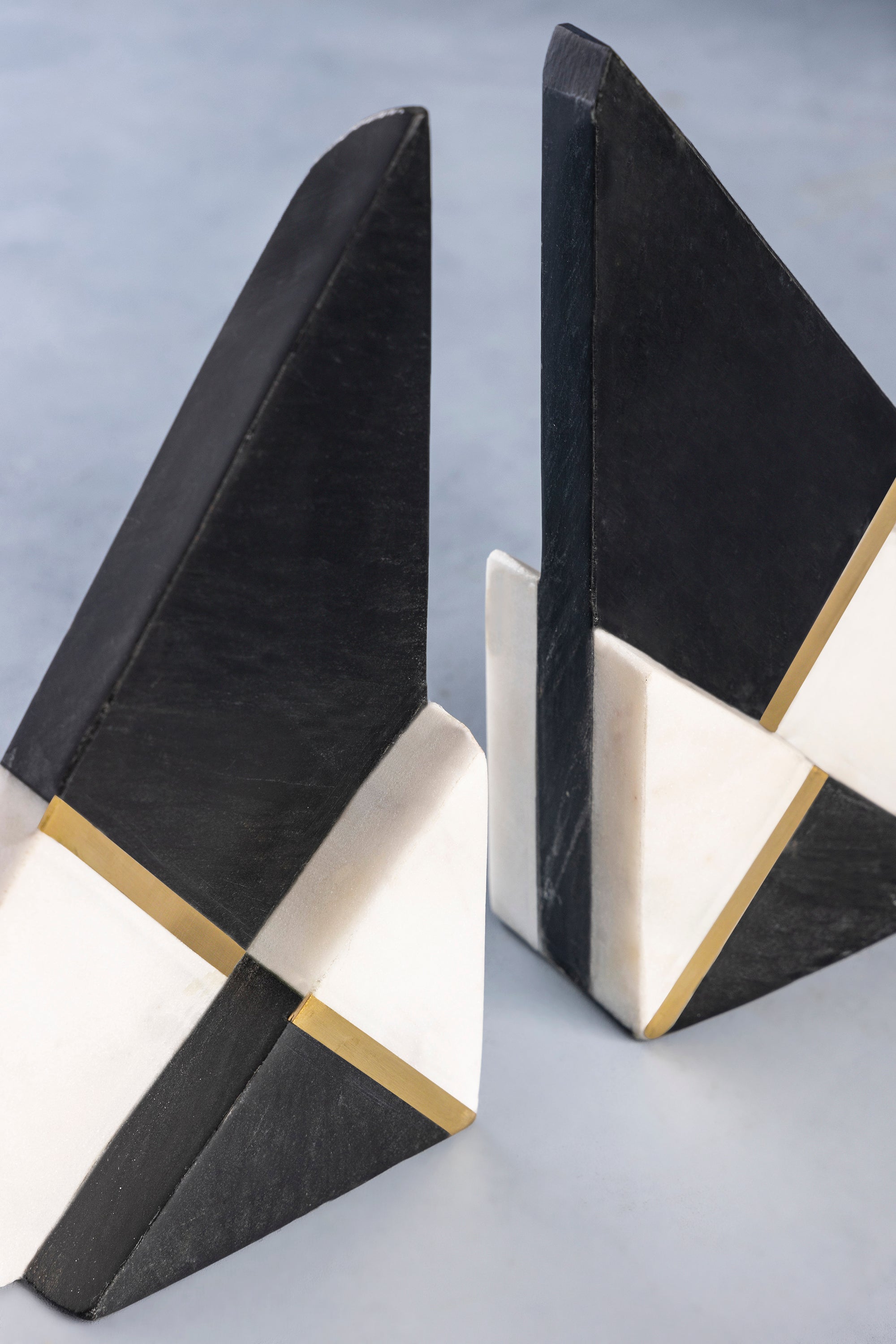 Contemporary Marble Bookends – Black and White with Gold Accent
Elegant bookends made from polished black and white marble, featuring clean lines and a gold accent, perfect for organizing books with modern flair