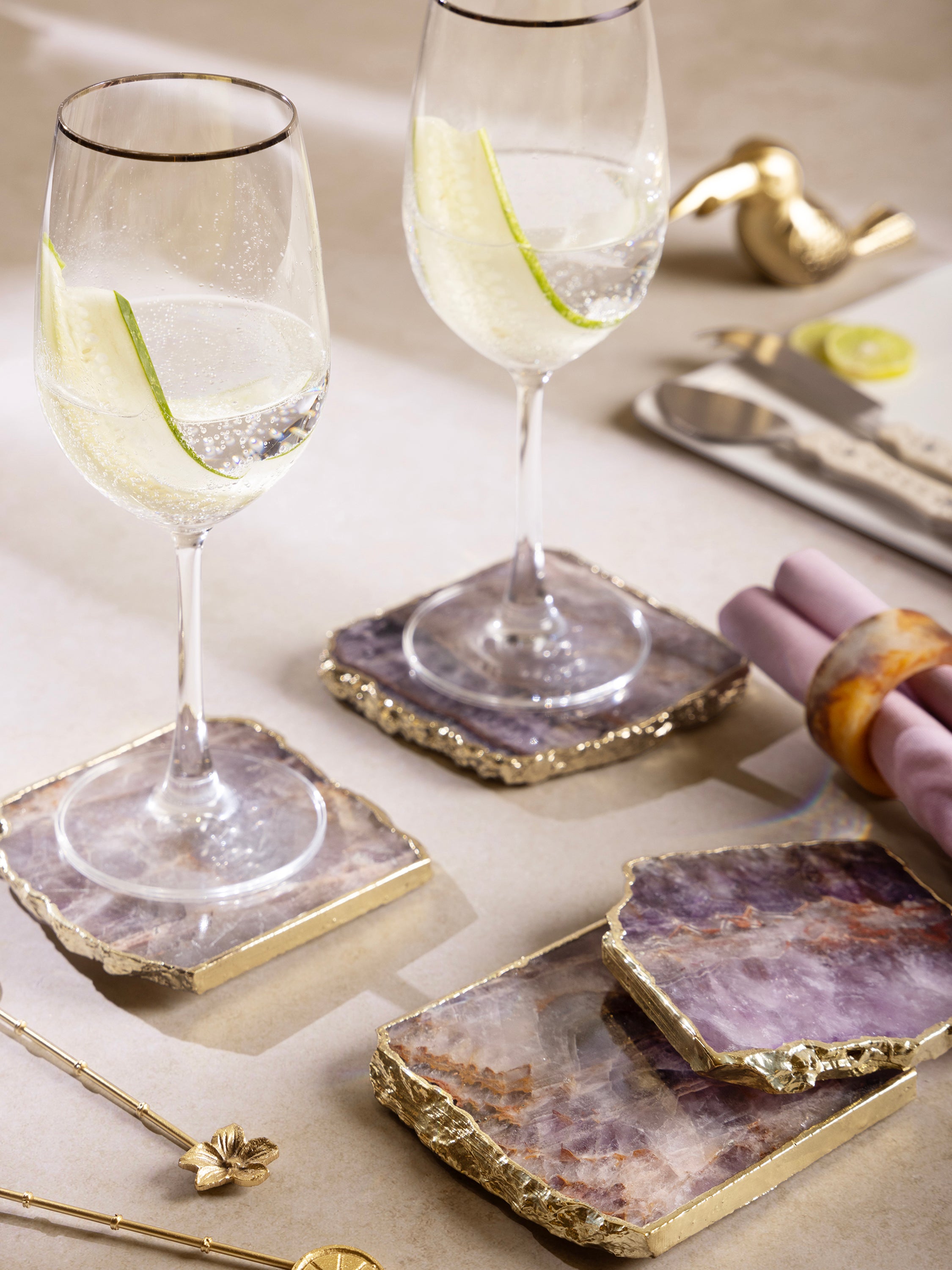 Handcrafted natural amethyst crystal coasters, ideal for coffee tables and bar settings