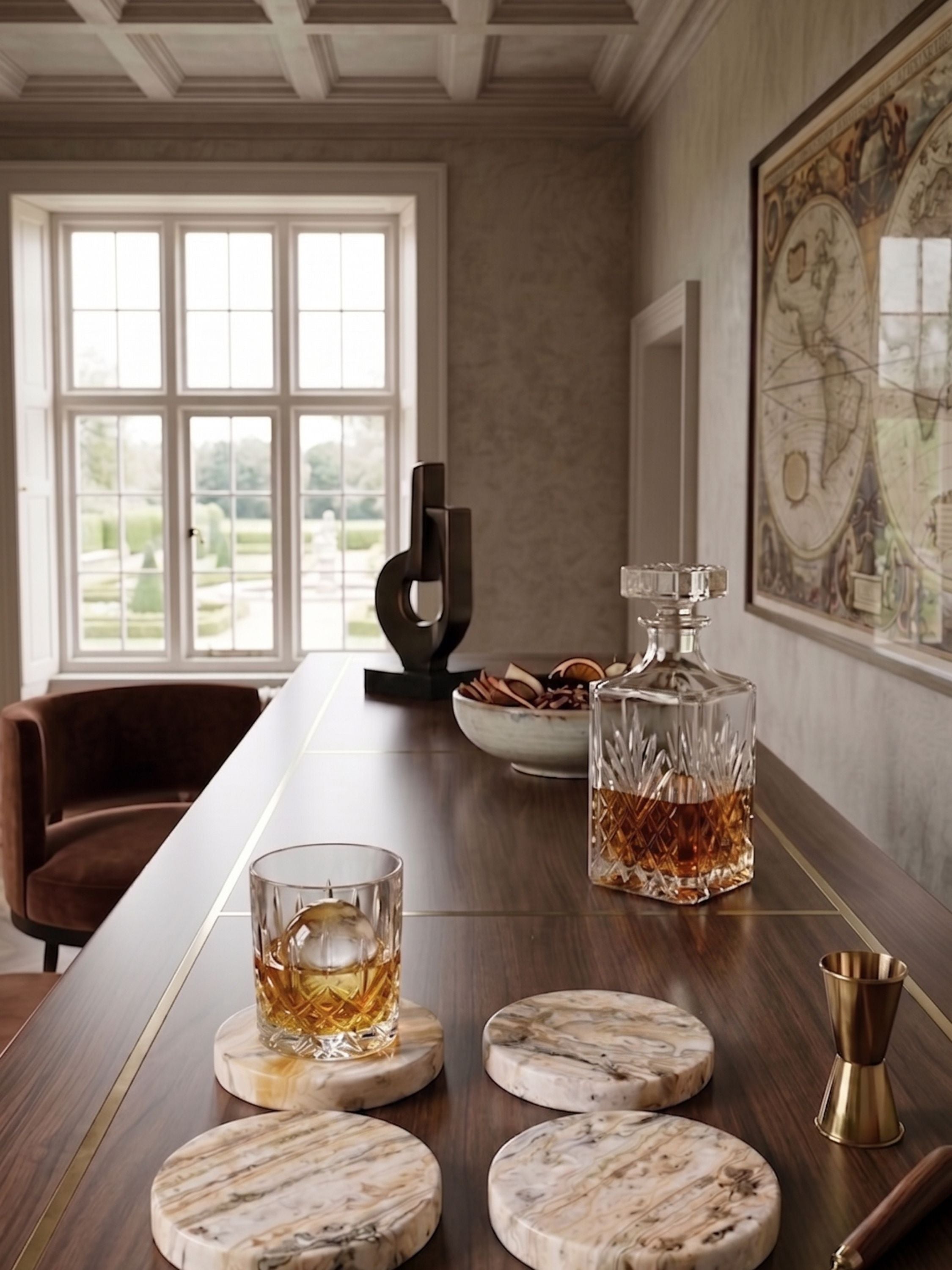 Onyx coasters, set of four, with warm tonal variation, arranged on a wooden table with glassware in a refined interior setting