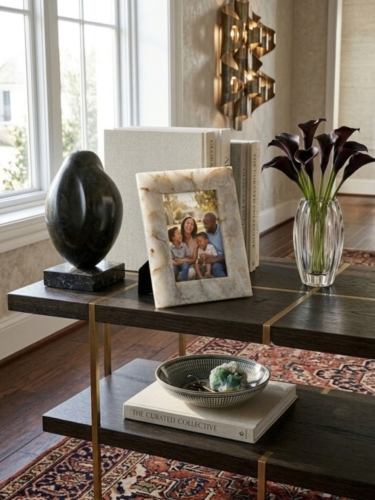 Agate stone picture frame with mosaic tile pattern, styled on a living room console.