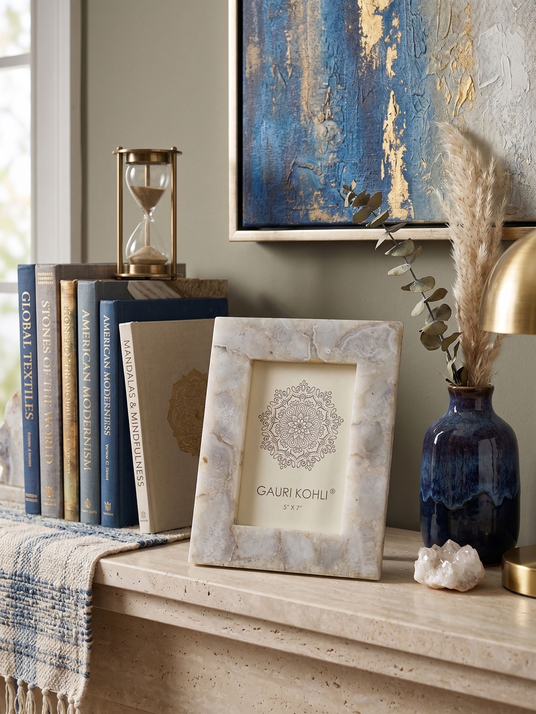 Agate picture frame displayed on a shelf with books and decor accents in a warm, styled interior setting
