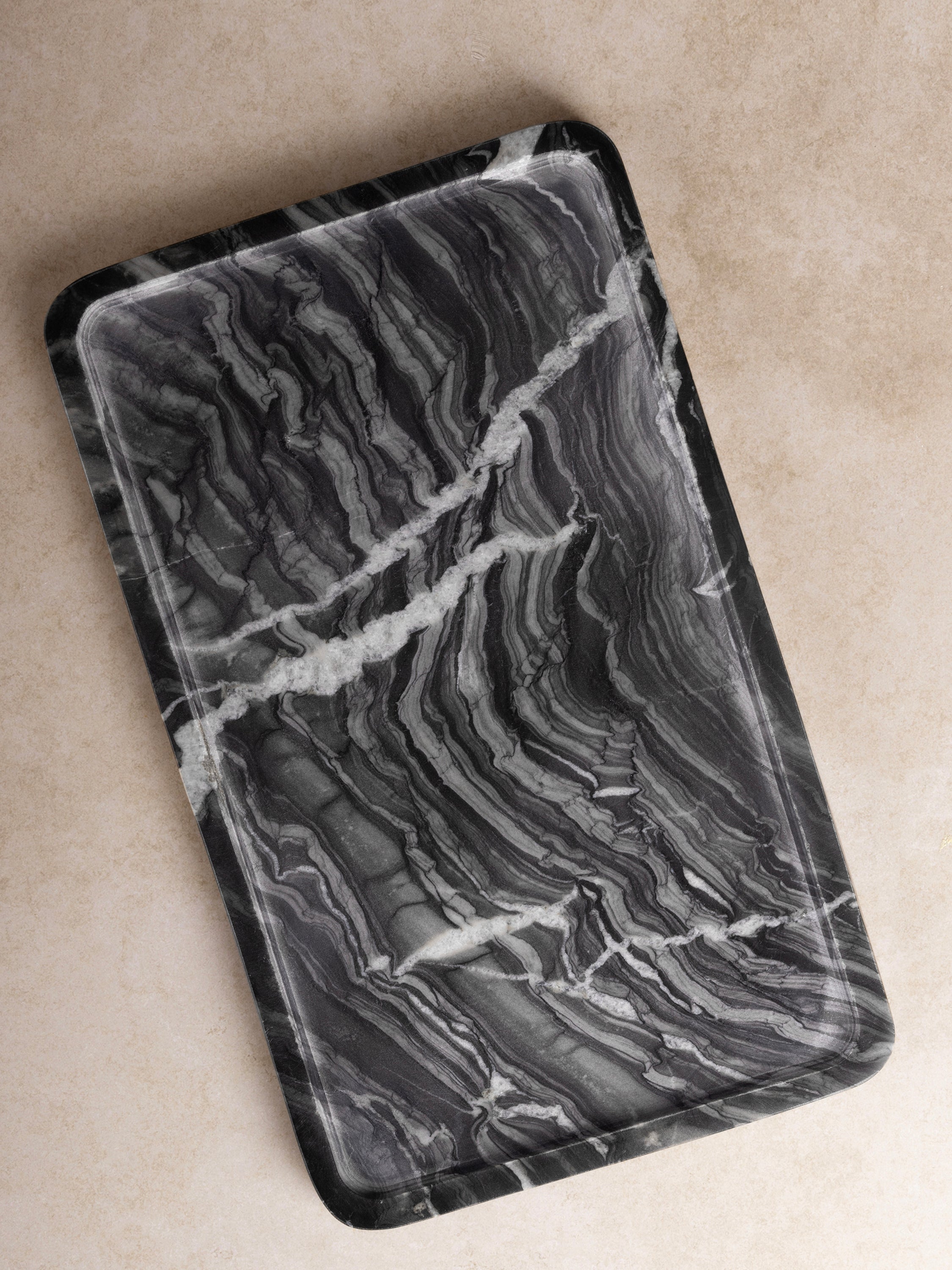 Luxurious black marble tray with striking white veining, perfect for modern decor
