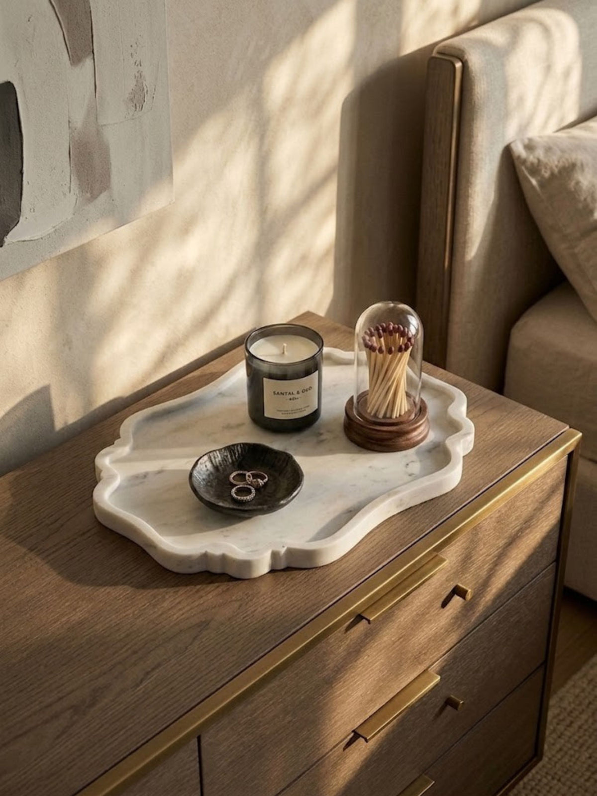 Scalloped white marble tray, styled on a bedroom nightstand.