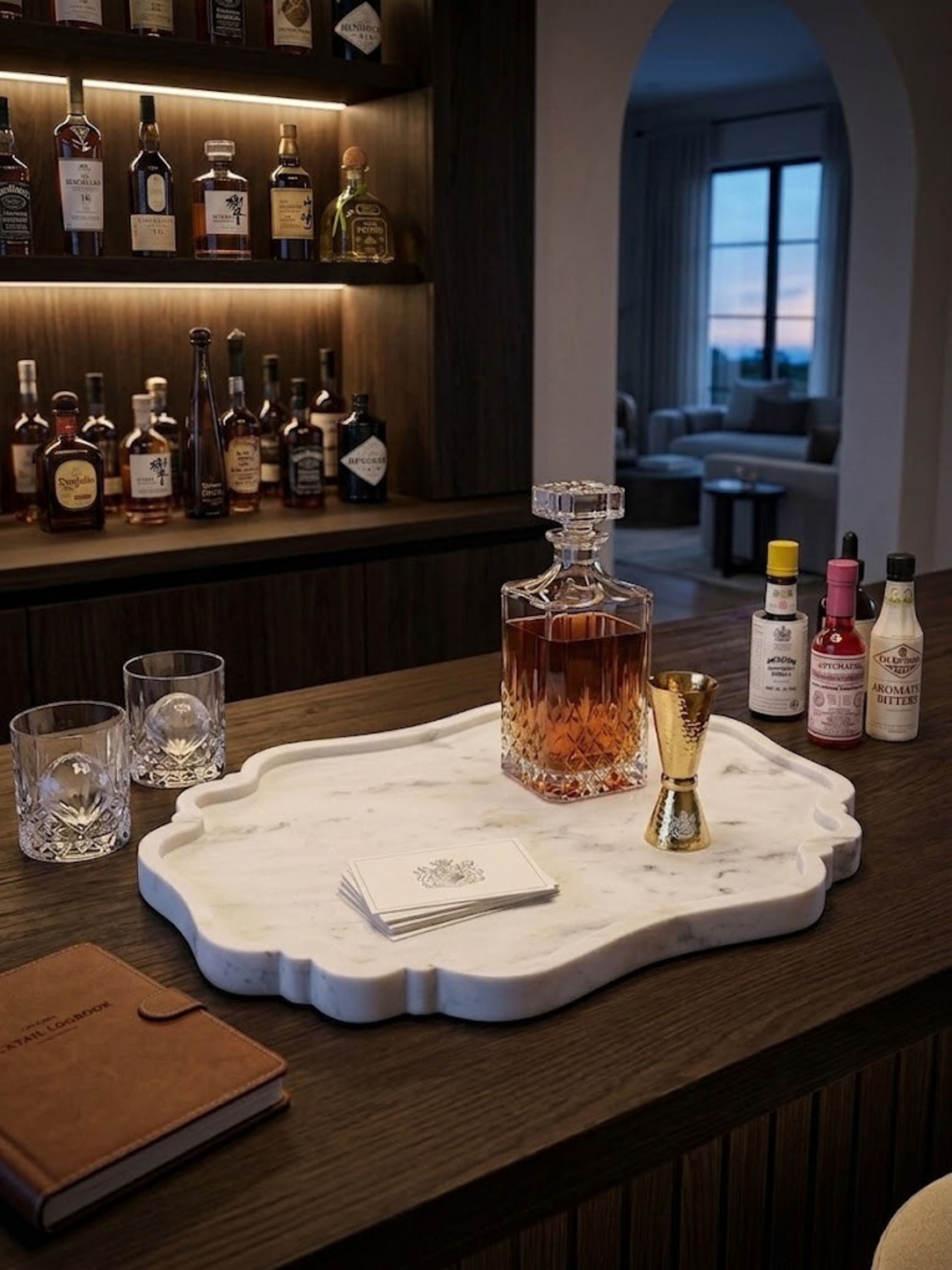 Polished white marble tray, styled at a home bar.
