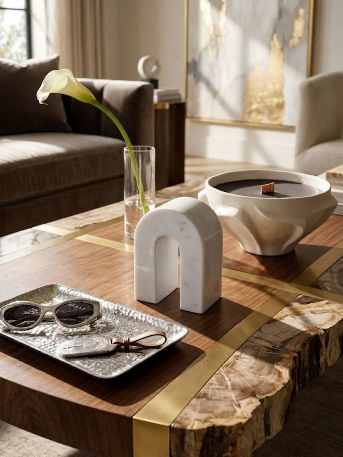 Matte white marble arch object, styled on a living room coffee table.