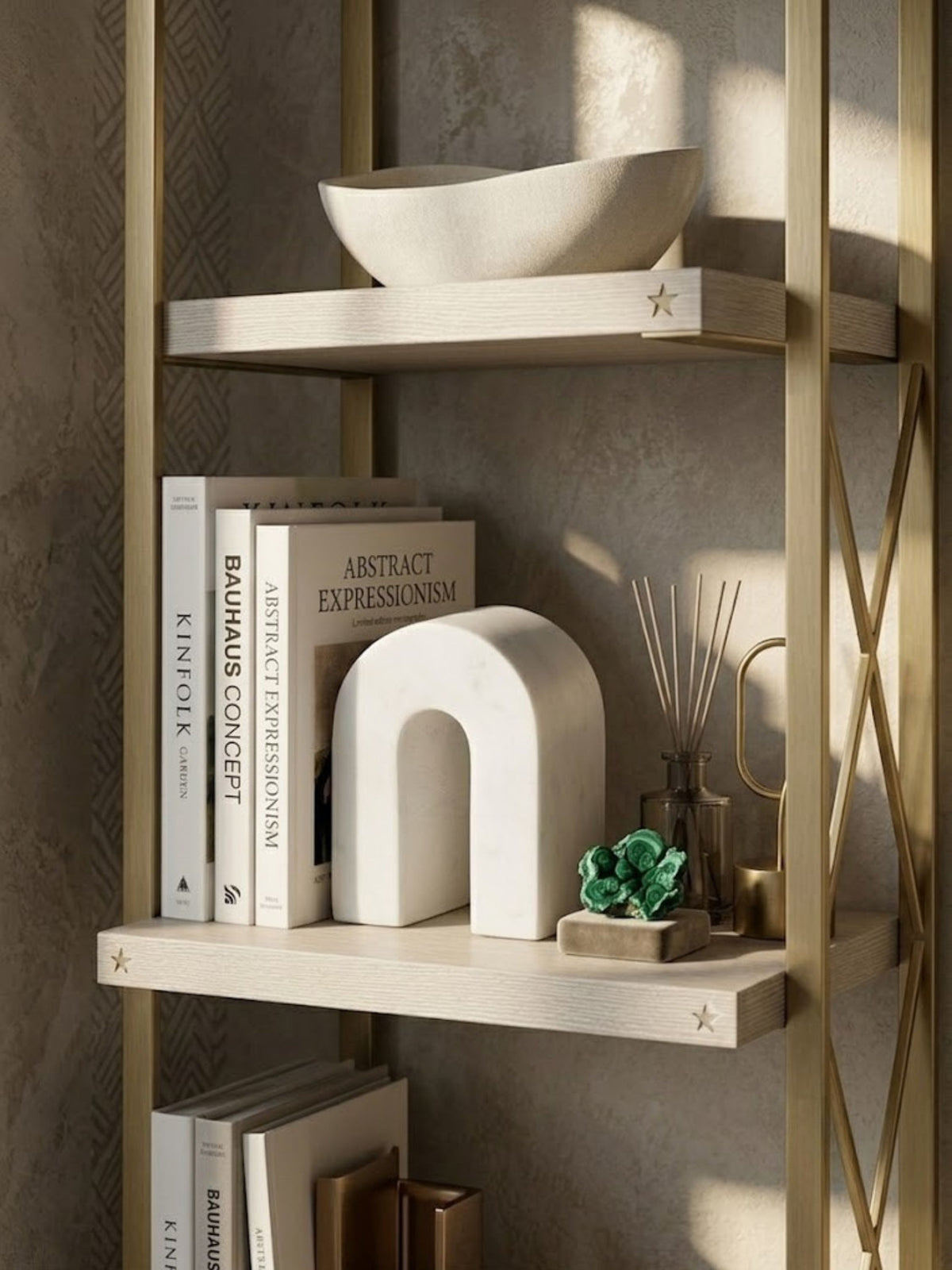 White marble arch object, displayed on a home library shelf.