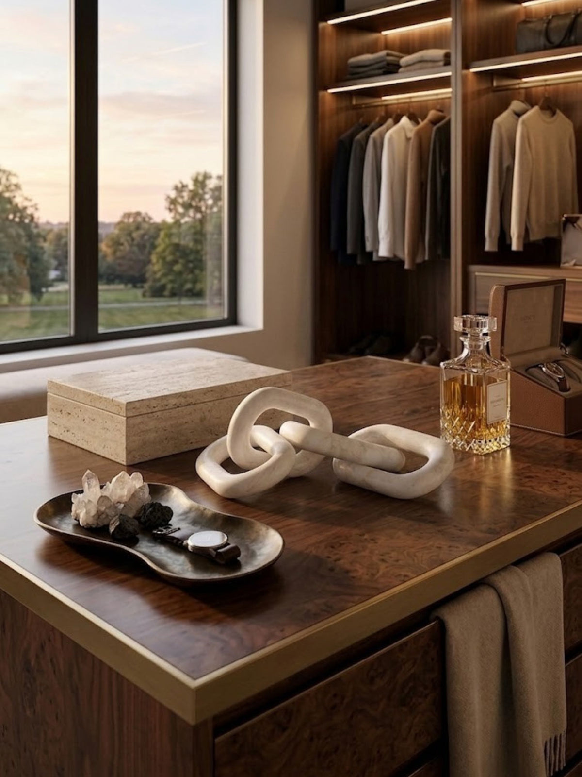 White marble chain-link sculpture displayed on a walk-in closet dresser.