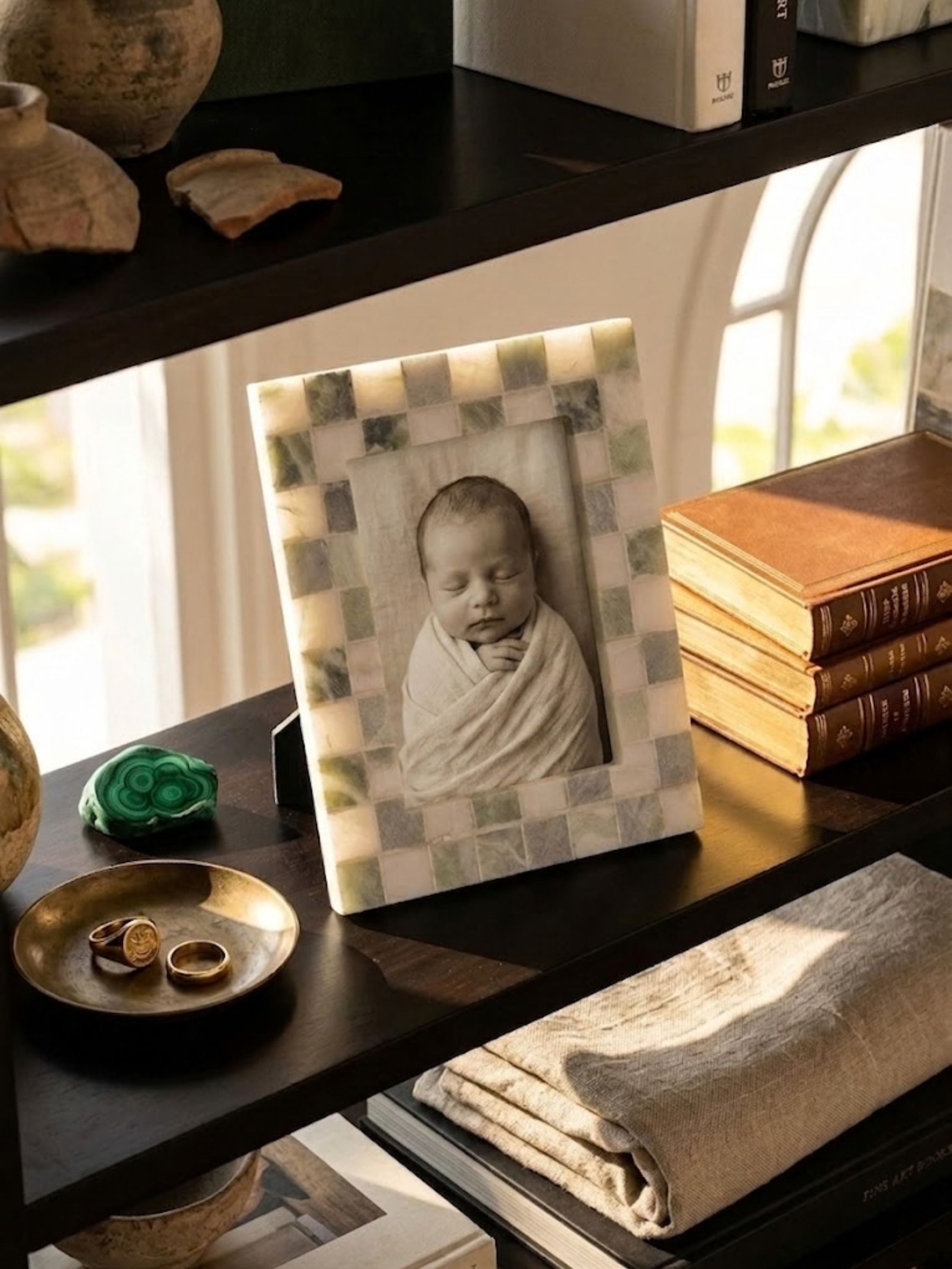 Austen green onyx mosaic frame styled within a shelf vignette, showing its gentle green hues among collected objects.