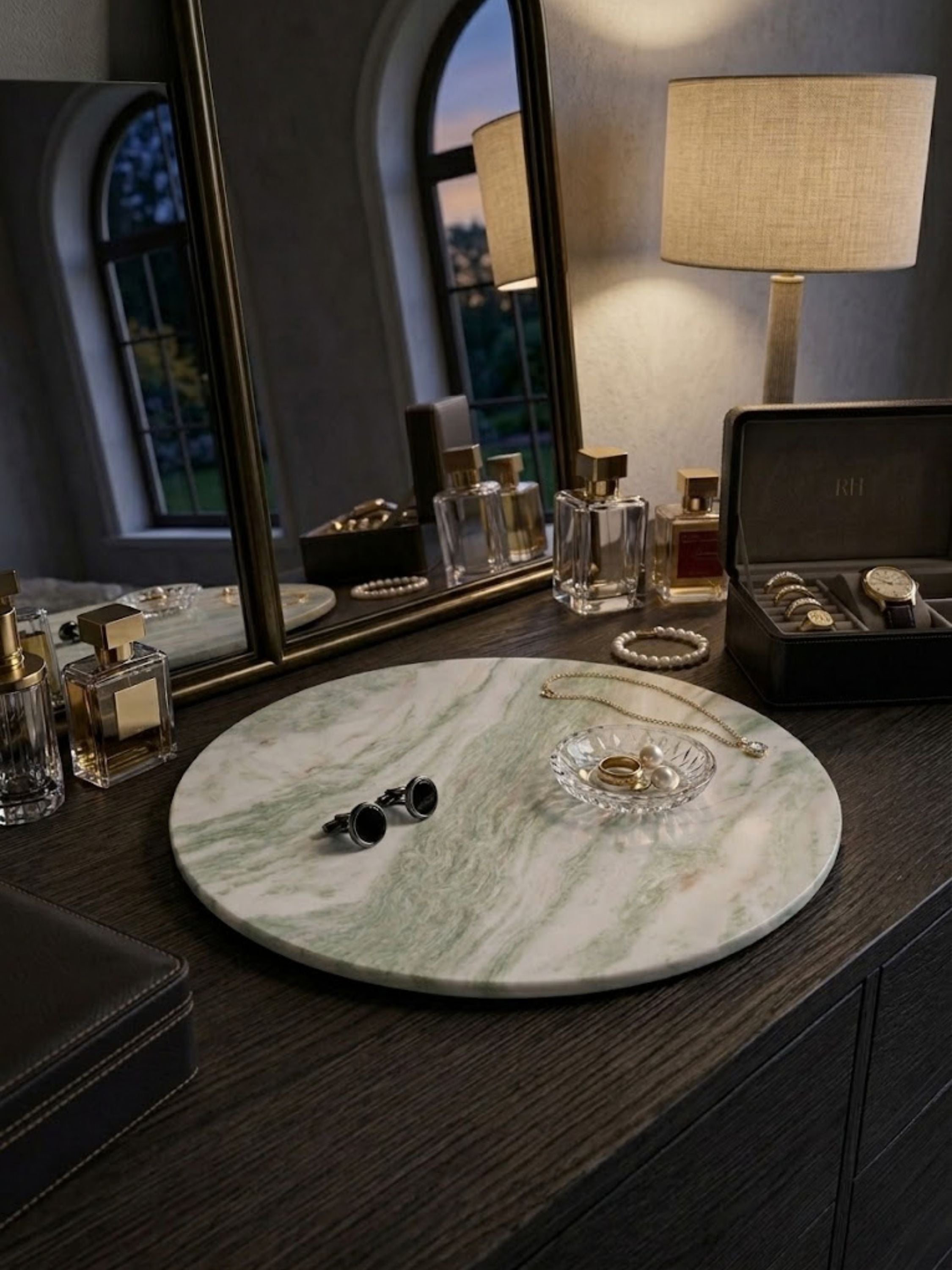Moonlight onyx tray arranged on a vanity with fragrance bottles and jewelry, offering a foundation for personal essentials.