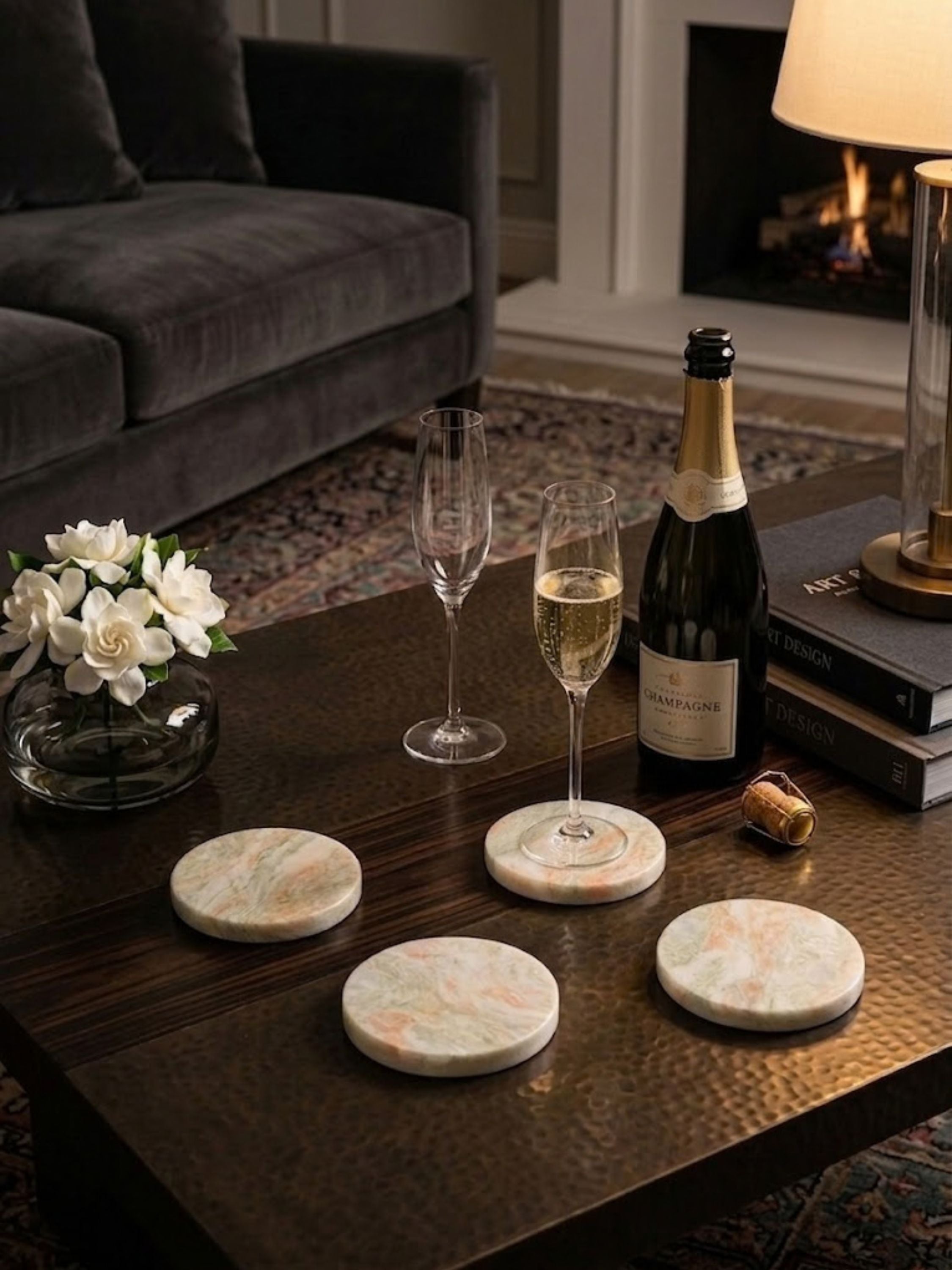Moonlight onyx coasters arranged on a cocktail table with champagne service, their natural stone character suited to celebratory gatherings.