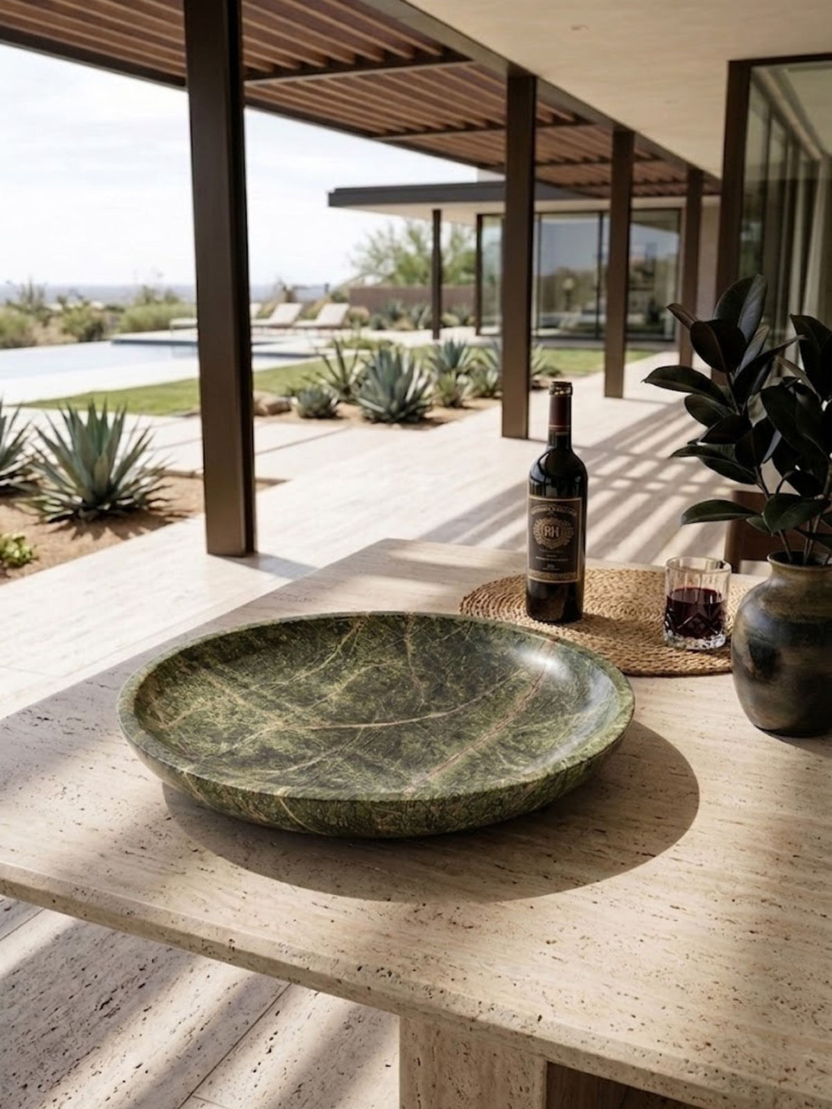 Green marble bowl styled on an outdoor bar counter.