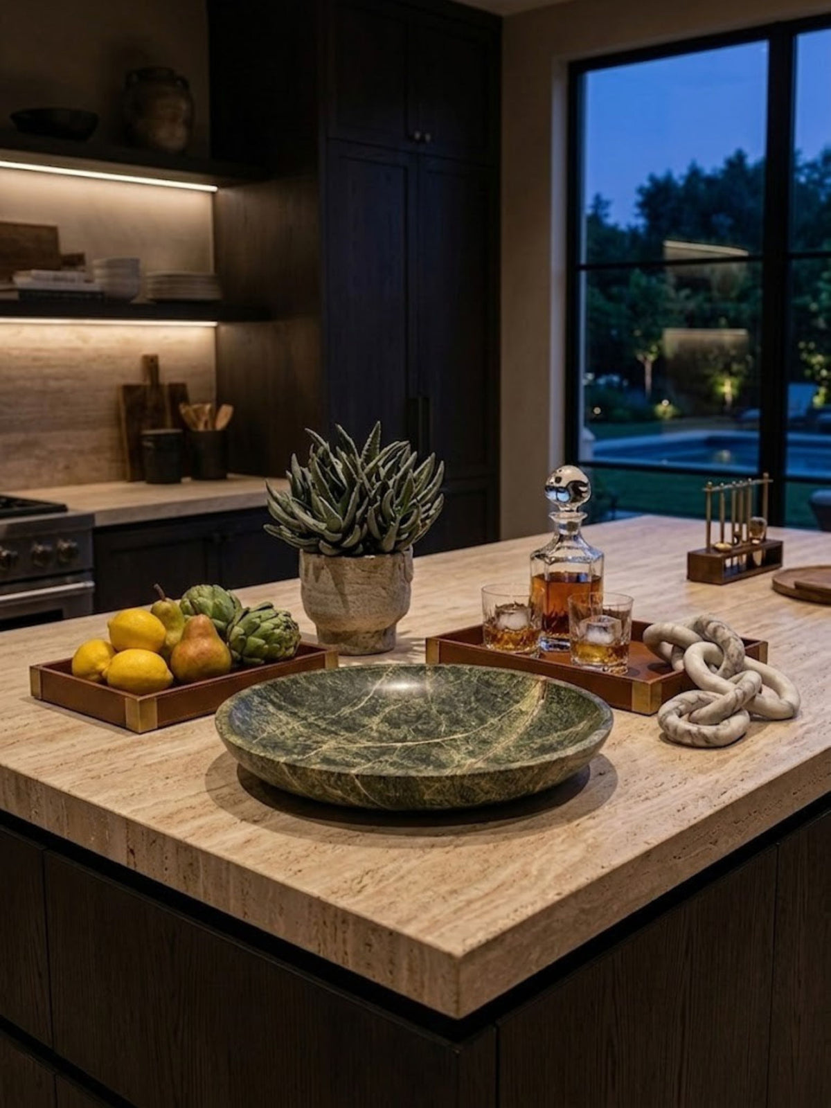Green marble bowl with terracotta veining, styled on a kitchen counter.