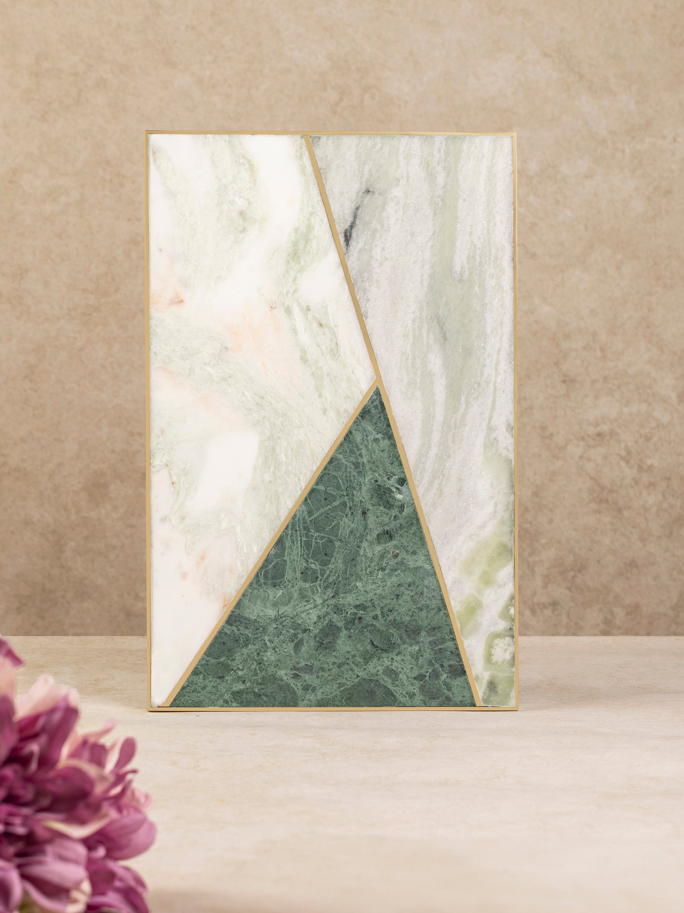 Brno marble cheese board shown upright from the side, highlighting board thickness, geometric stone inlay, and clean edge profile