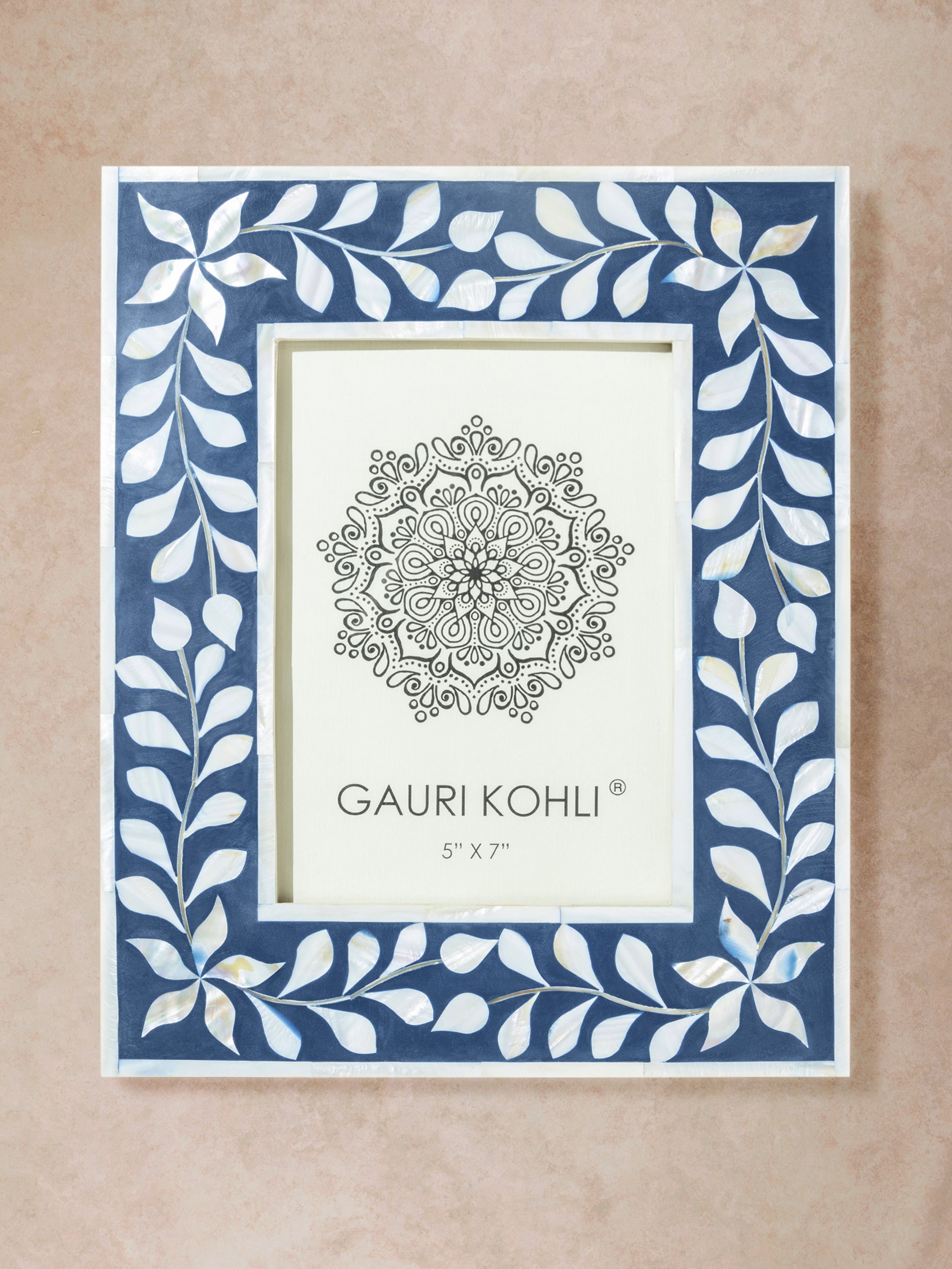 Rectangular picture frame with blue and ivory bone inlay featuring repeating vine pattern and defined inner frame structure