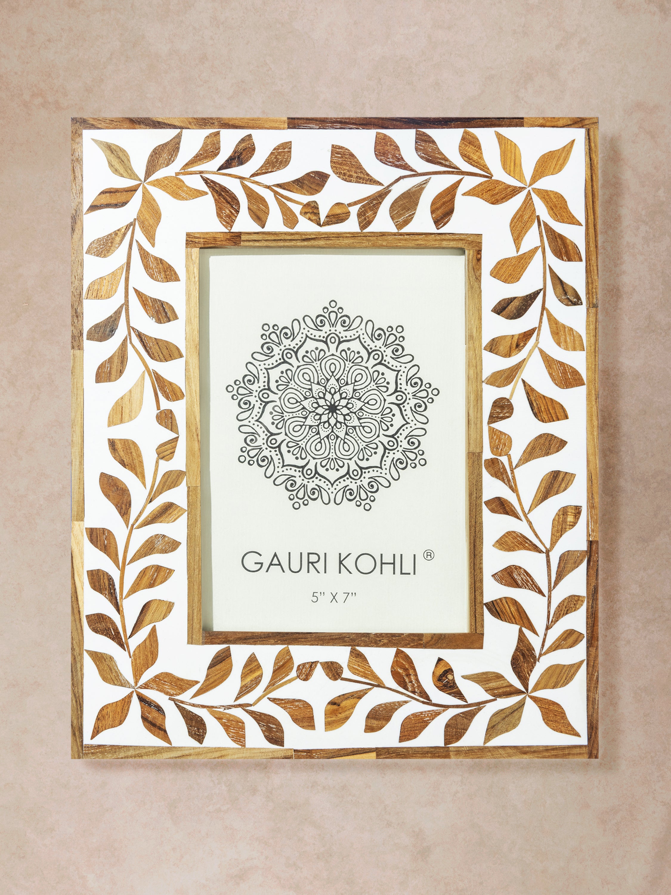 Rectangular picture frame with natural wood and ivory bone inlay featuring floral vine border and structured inner frame