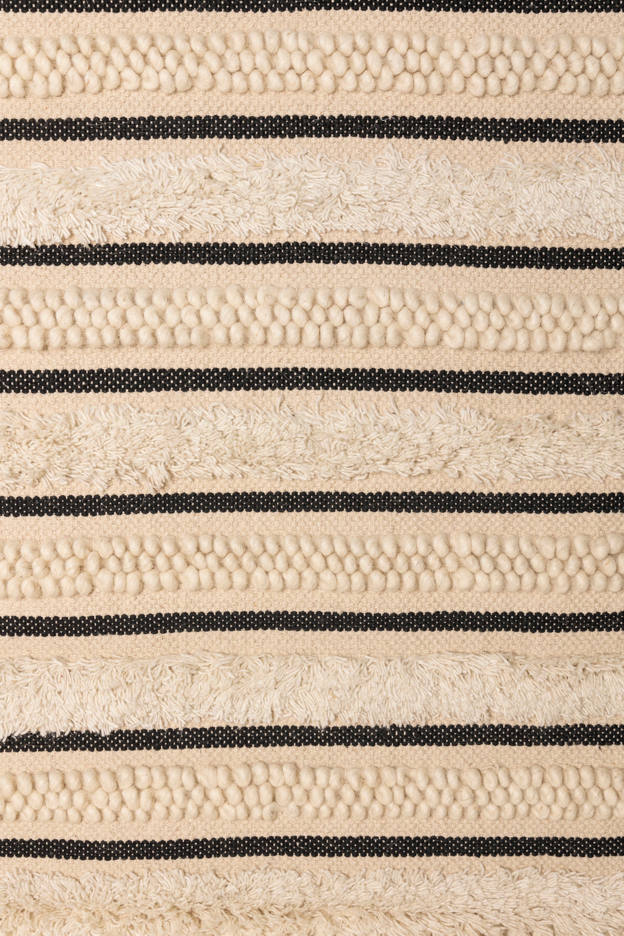 Artisan-crafted woven wall tapestry in beige and black, perfect for living rooms and bedrooms