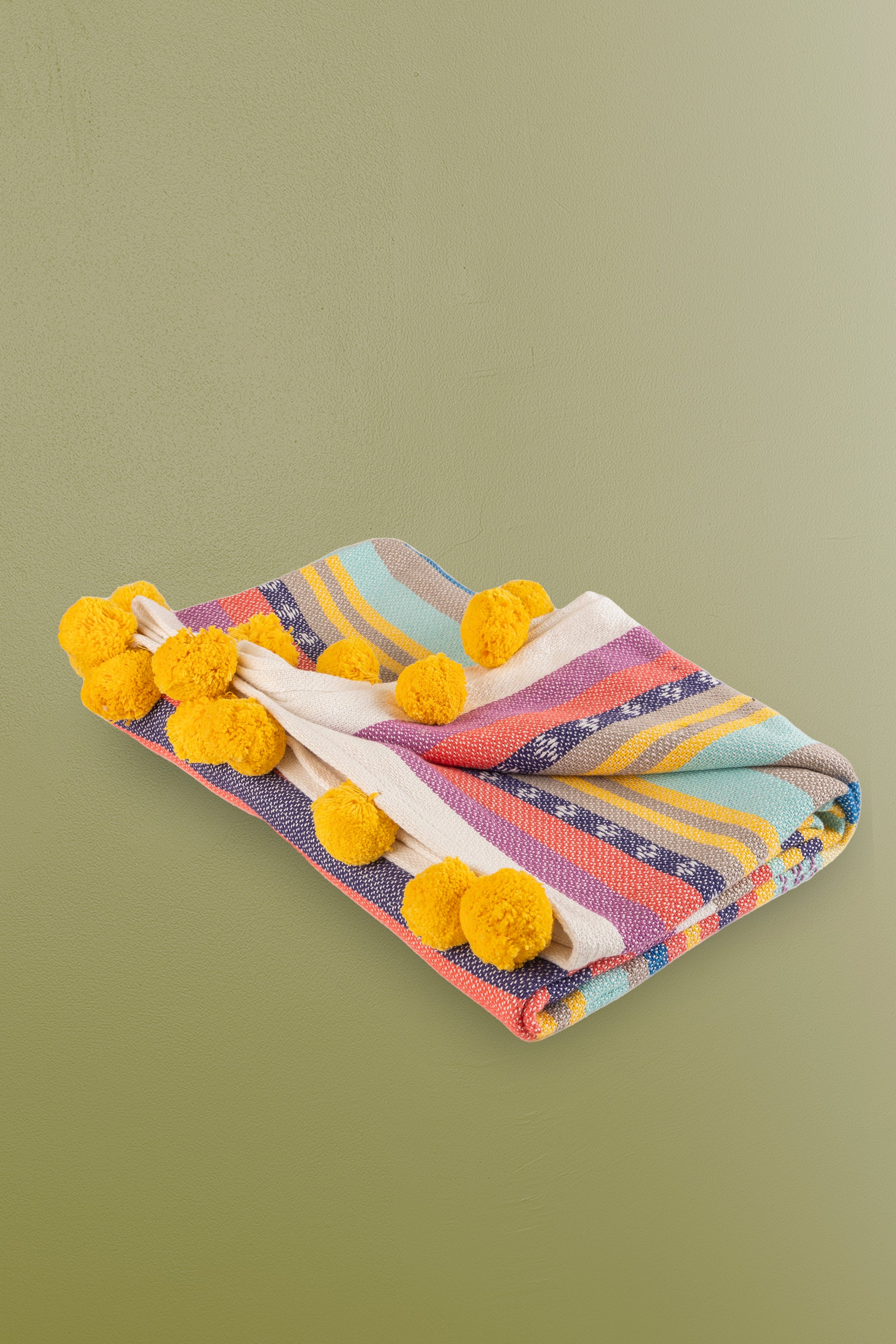 Lightweight and breathable striped throw blanket in bright, cheerful hues, ideal for layering on sofas, chairs, or beds