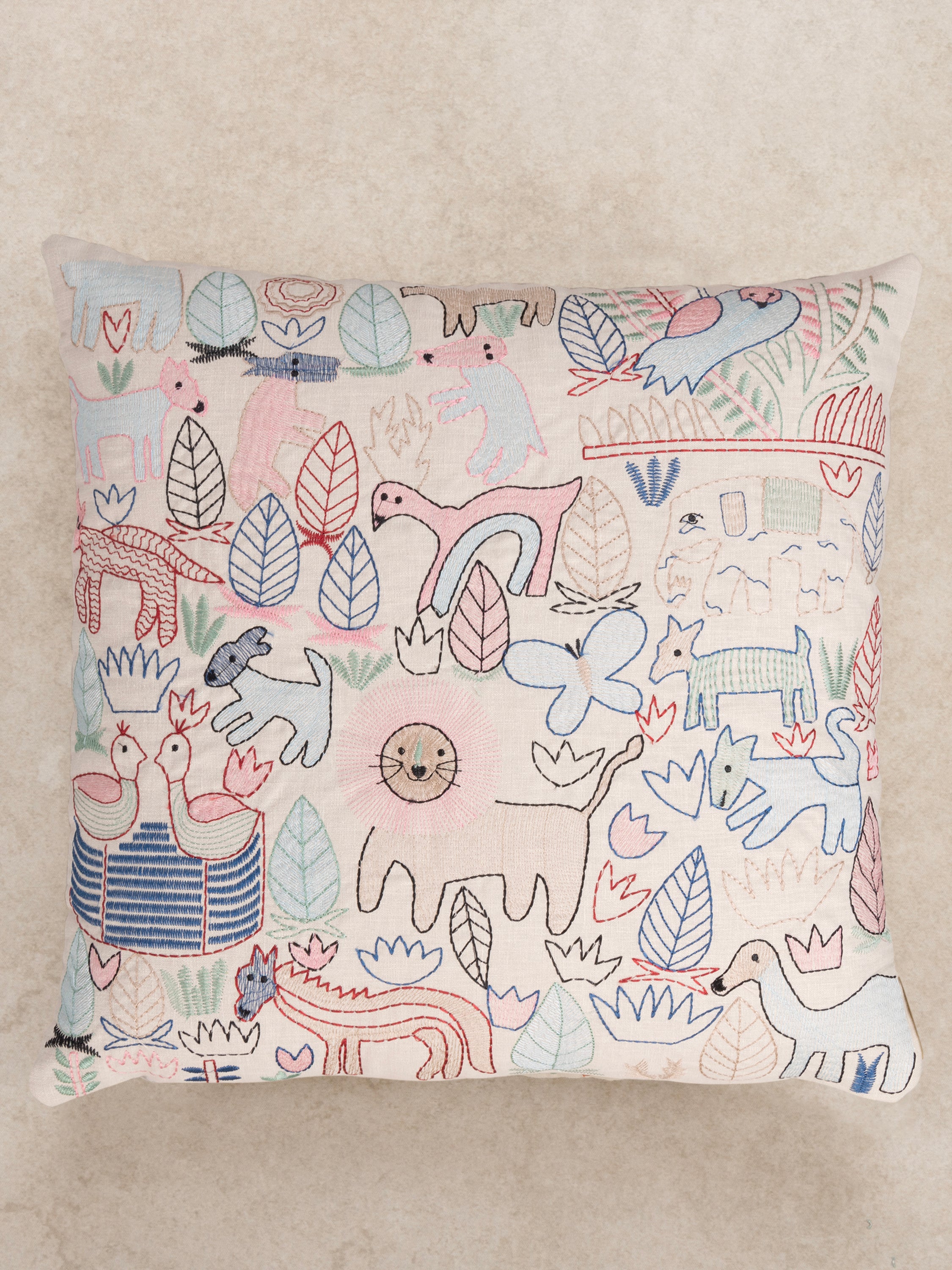 Boho-Inspired Whimsical Wildlife Pillow with Artistic Embroidery – A cozy accent cushion showcasing abstract hand-stitched animals, leaves, and geometric patterns in pastel tones