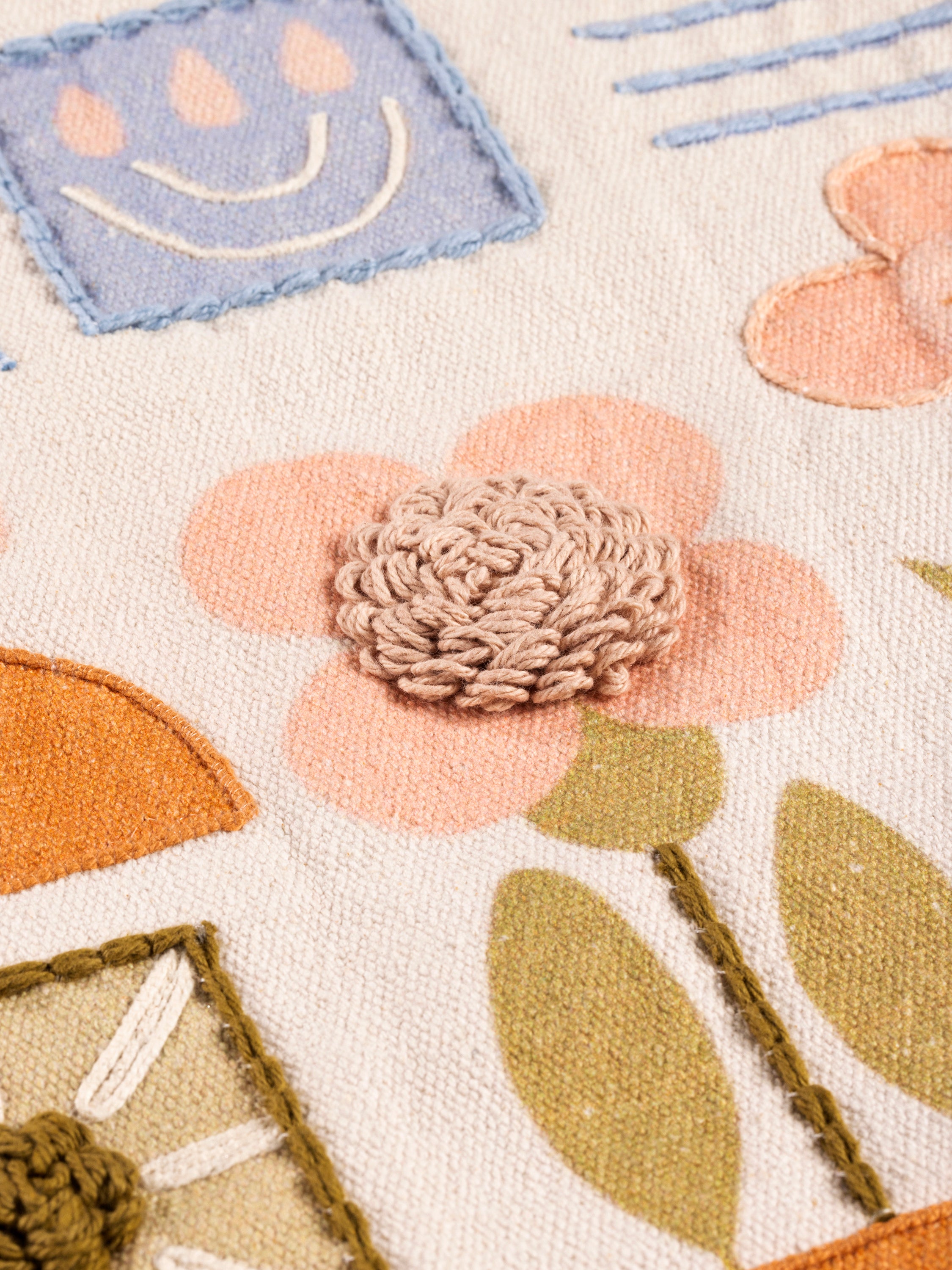 Soft Cotton Throw Pillow with Bohemian Floral & Abstract Stitching – A cozy and artistic pillow with embroidered flowers, rainbows, and subtle geometric accents, perfect for contemporary or eclectic home decor