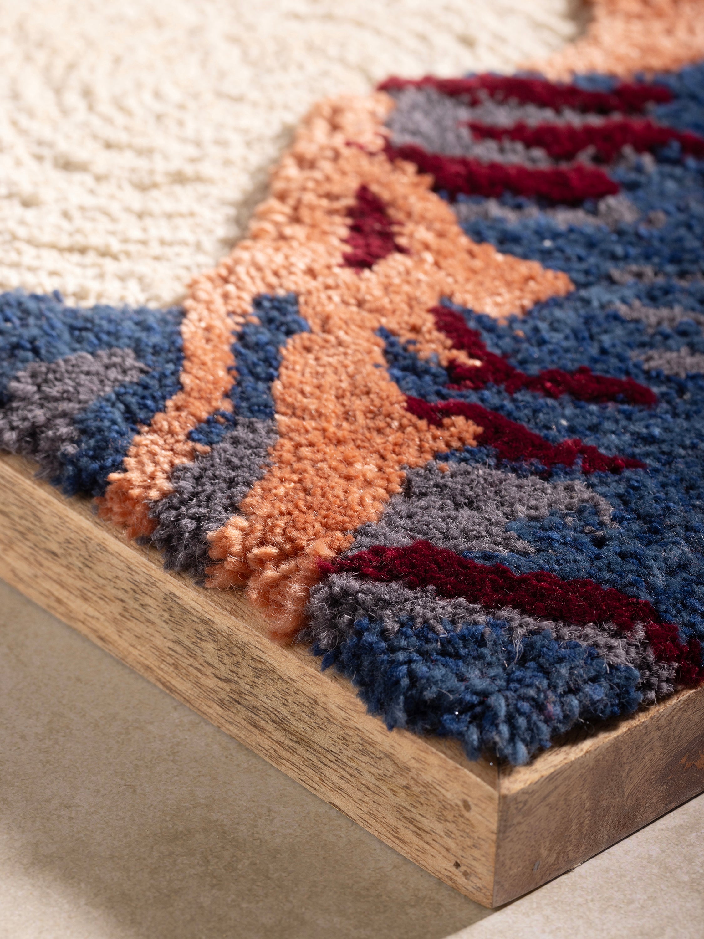 Boho-Inspired Wool Wall Hanging with Scenic Mountain Design – A handcrafted wall tapestry showcasing an abstract mountain range with rich earth tones and soft tufted textures