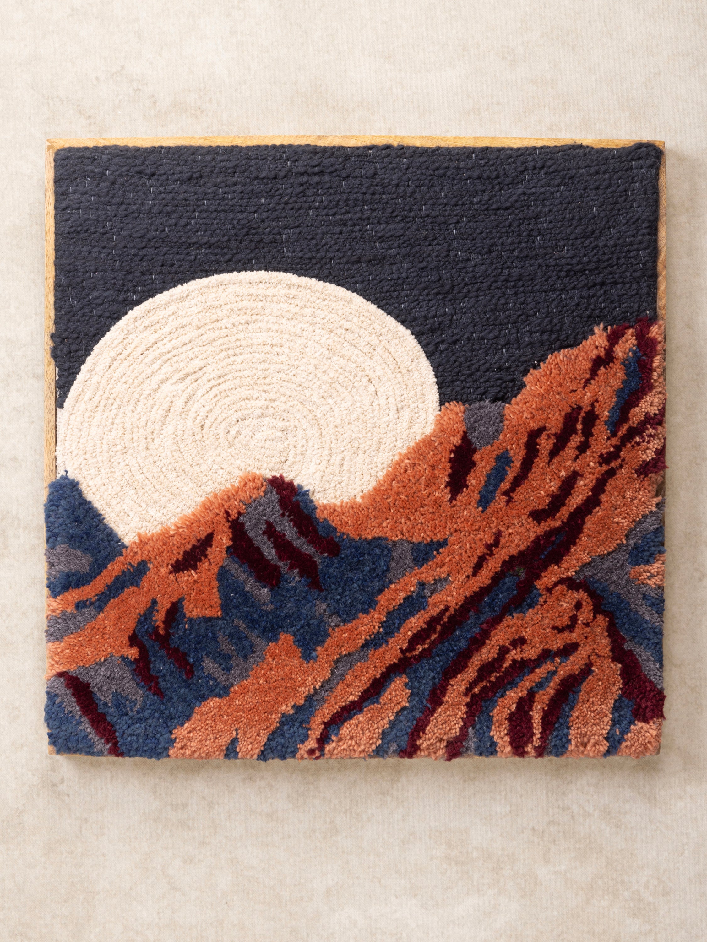 Handcrafted Tufted Wall Art with Moon & Mountain Landscape – A textured, modern wall hanging featuring a bold full moon and rugged mountain design in deep earthy tones