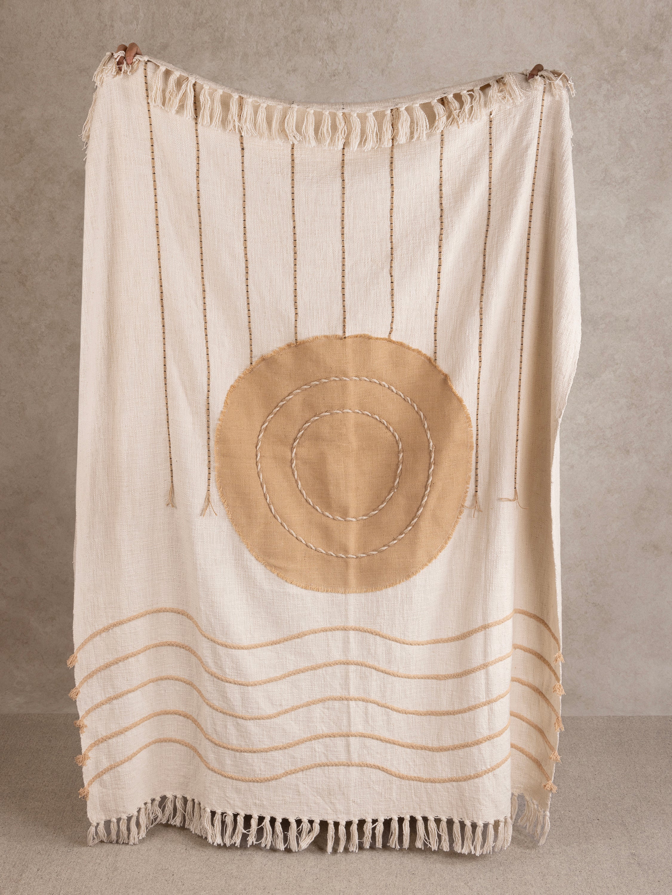 Minimalist Boho Throw Blanket with Sun & Wave Embroidery – A soft, handcrafted throw featuring a warm-toned sun and flowing wave stitch details, finished with delicate fringe