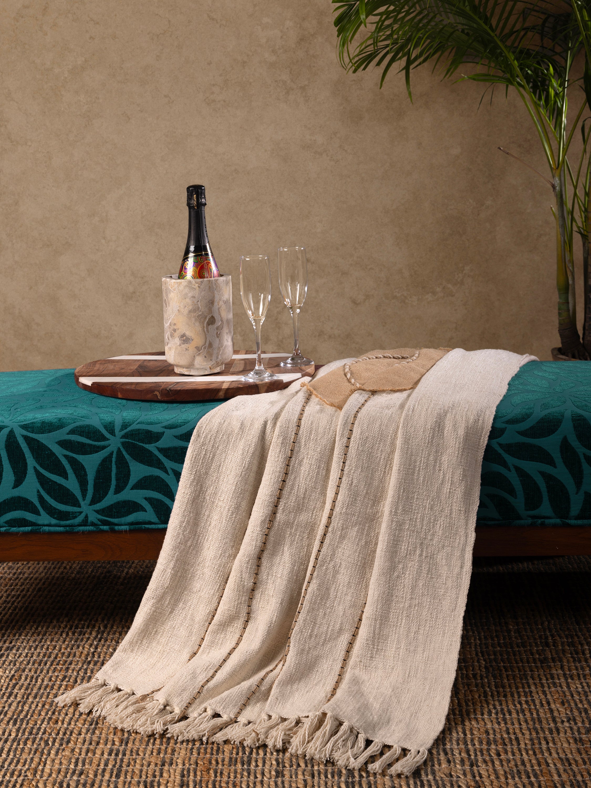 Beige Cotton Throw with Sunburst & Water-Inspired Accents – A lightweight decorative throw with a serene, nature-inspired pattern and hand-stitched textures