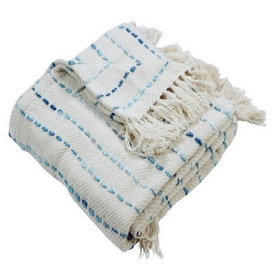 Soft beige knitted throw blanket for bed or couch