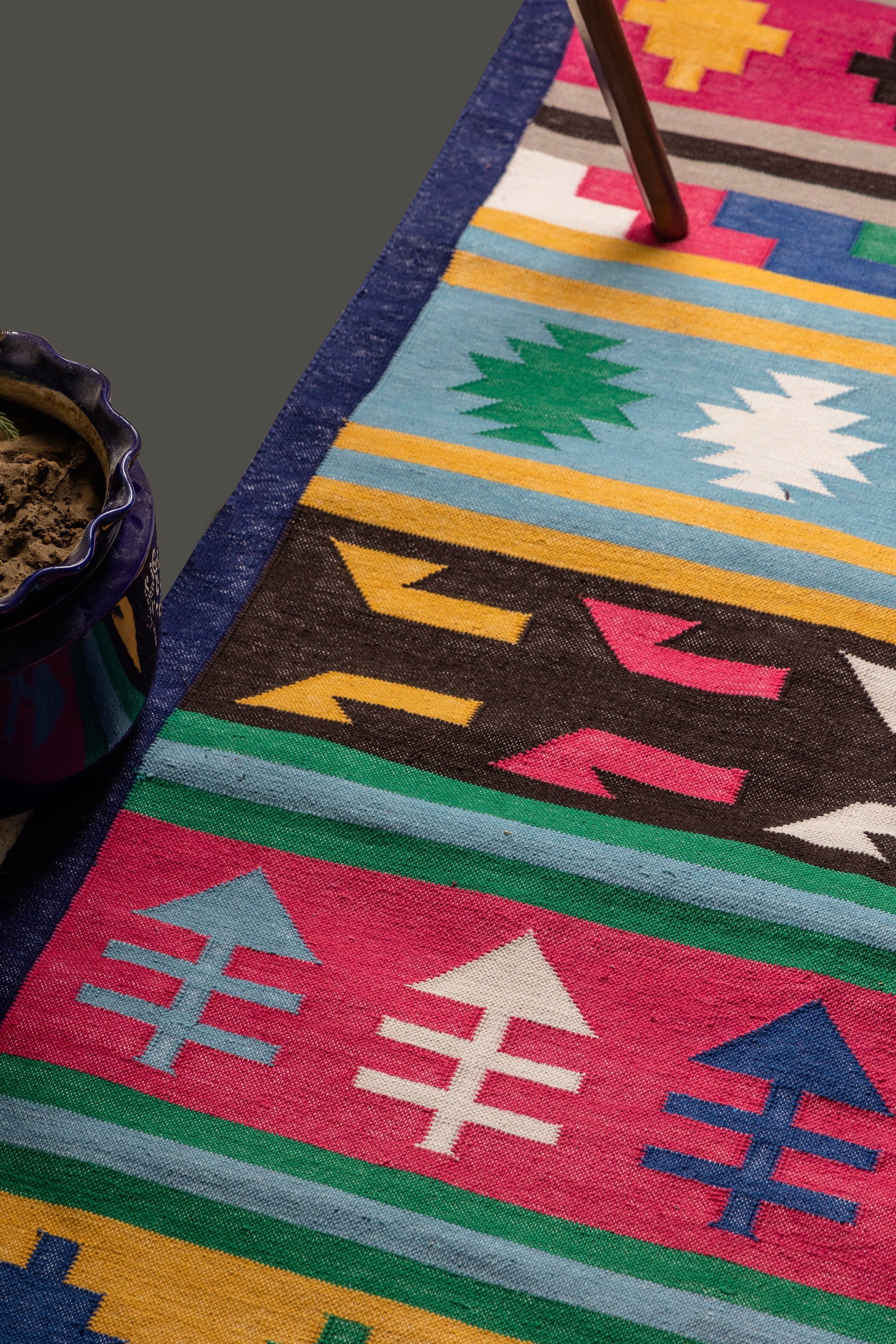 Handwoven Kilim runner rug with vibrant geometric tribal patterns and fringe edges