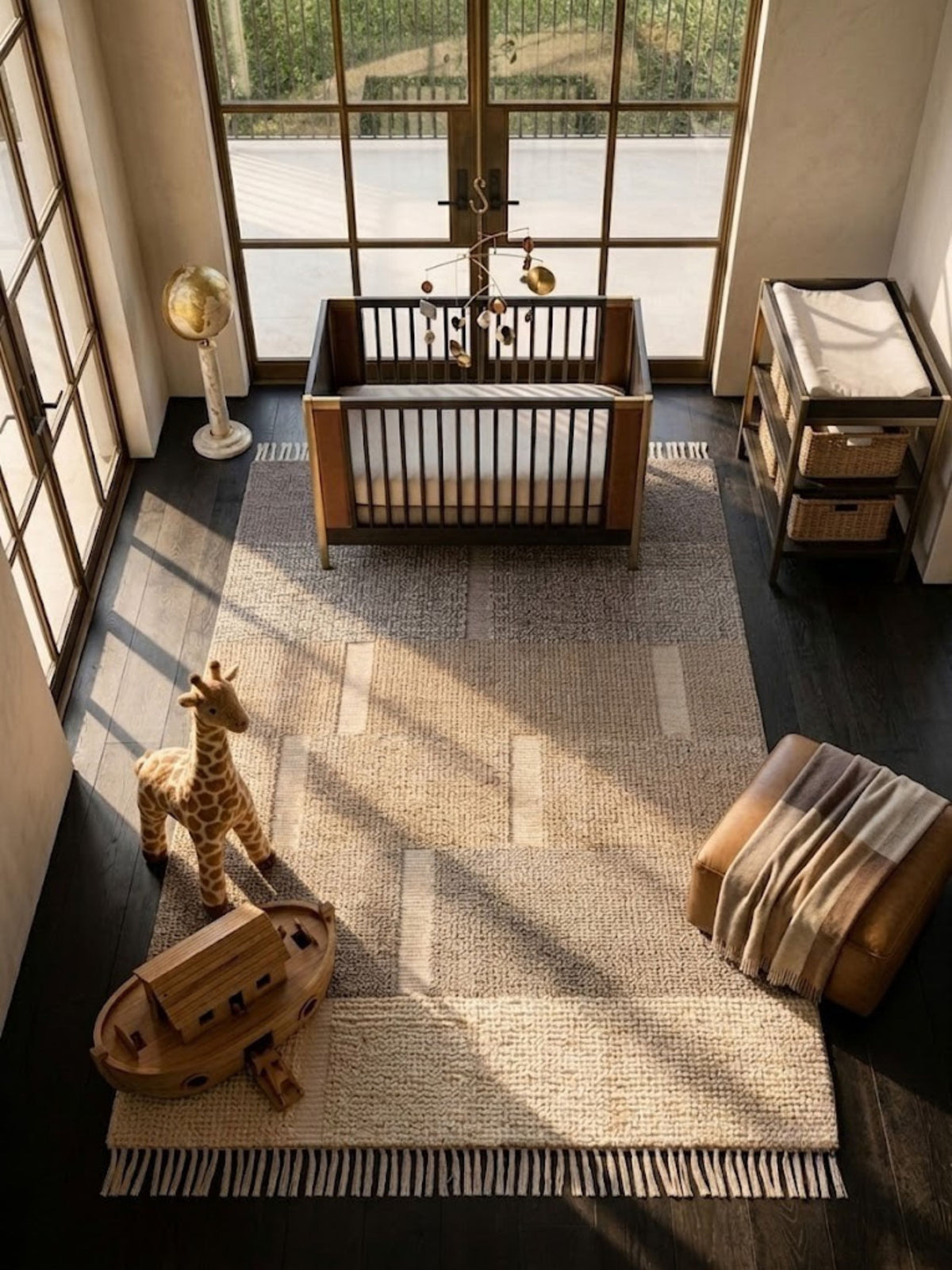 Wool and cotton rug with a twisted fringe edge, styled in a nursery.
