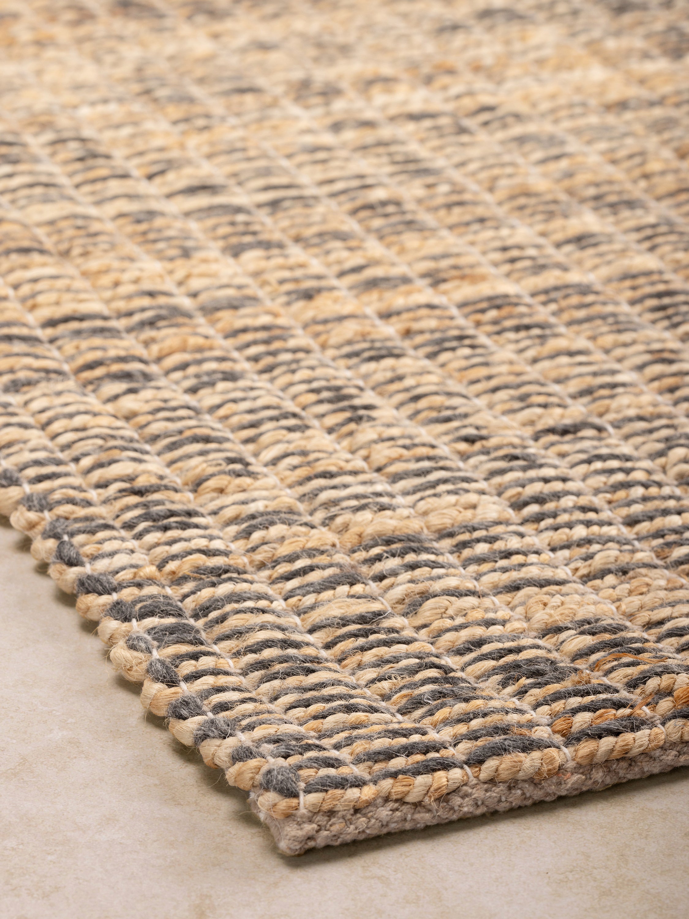 Rustic flatweave wool and jute rug, ideal for adding warmth and organic texture to any space