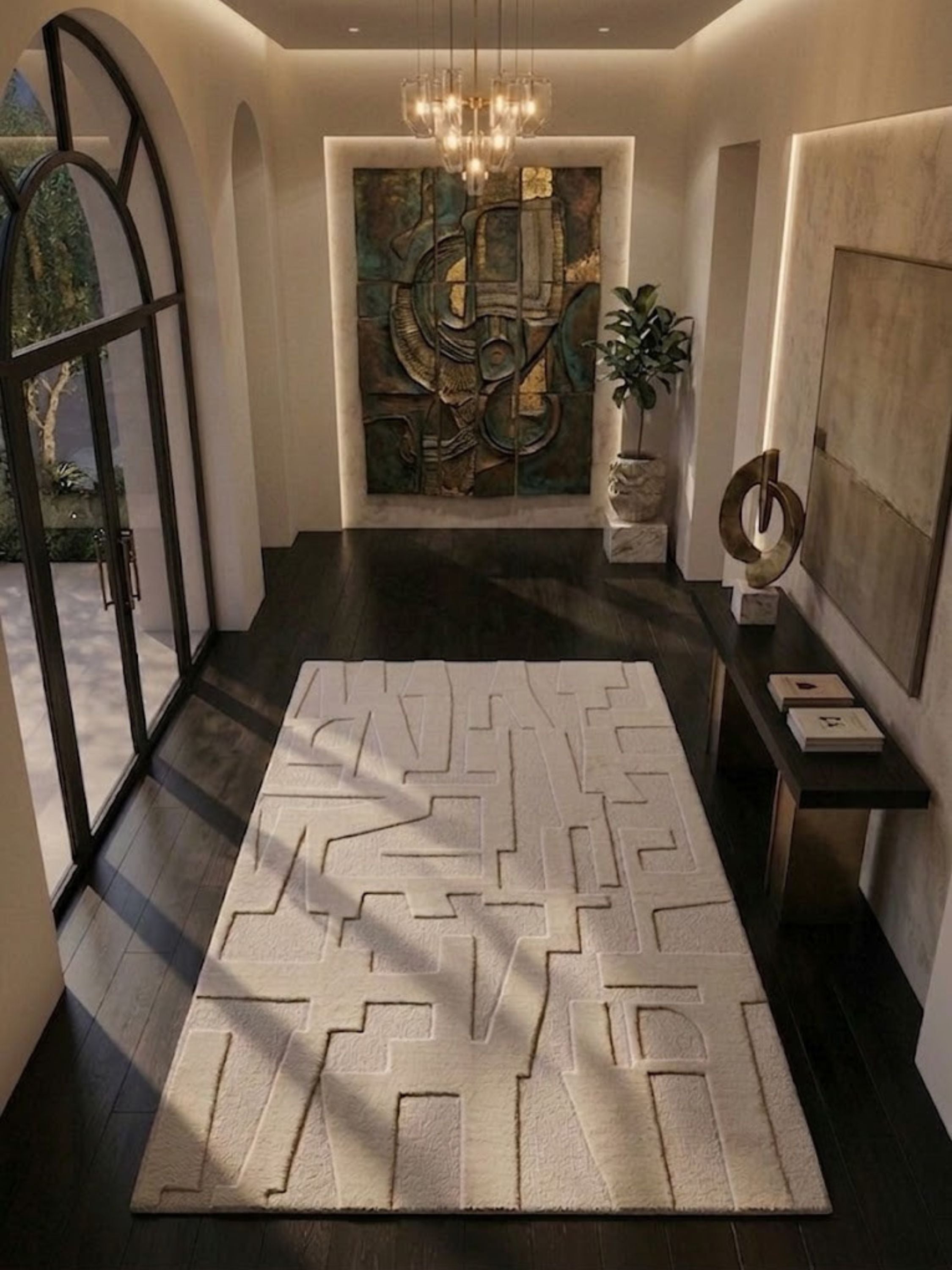 Ivory wool and cotton rug with a carved recess pile detail, styled in an entryway.