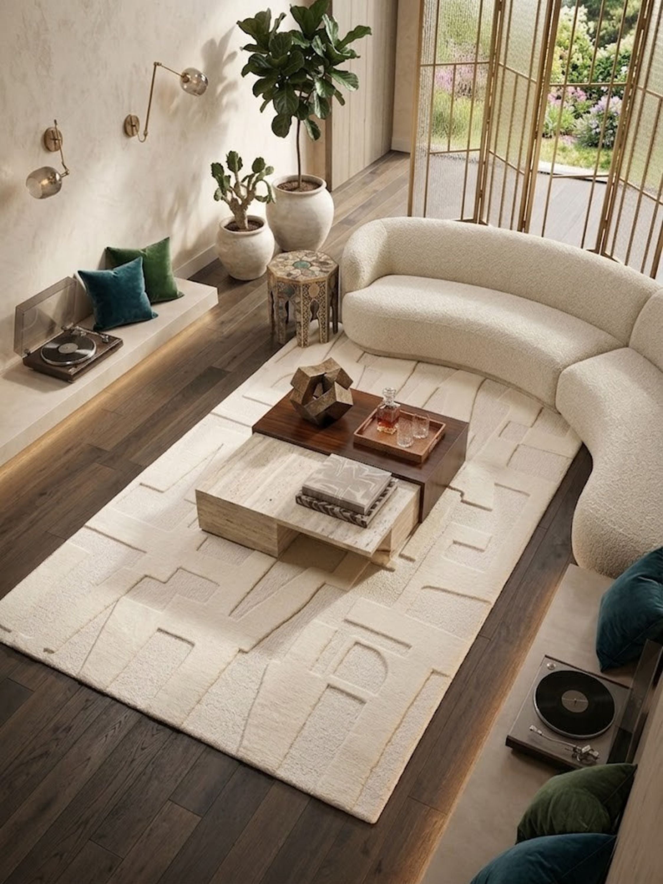 Ivory wool and cotton rug with a sculpted pile texture, styled in a living room.