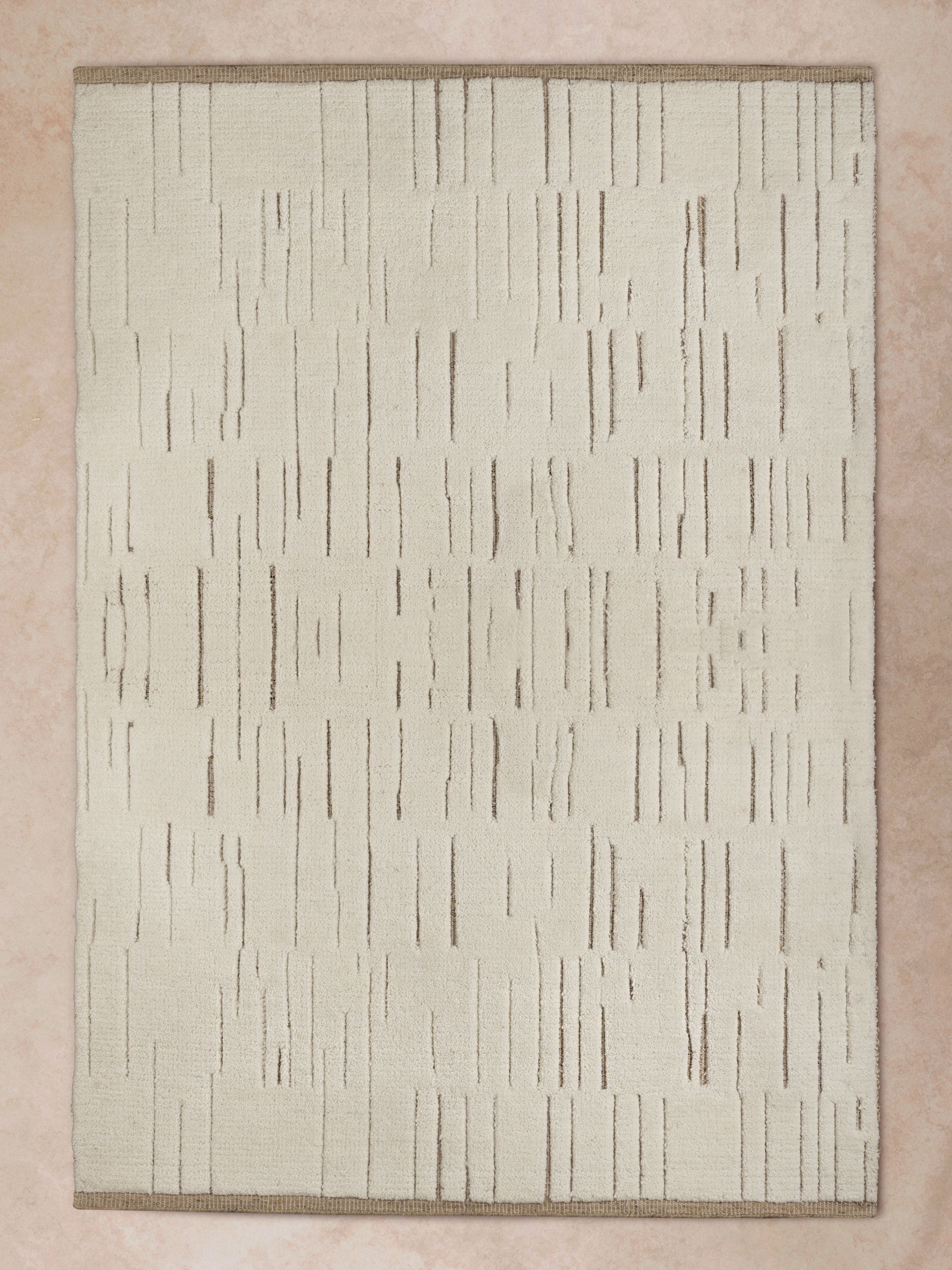 Full Top View of GAURI KOHLI Narita Ivory Textured Area Rug – 5x8