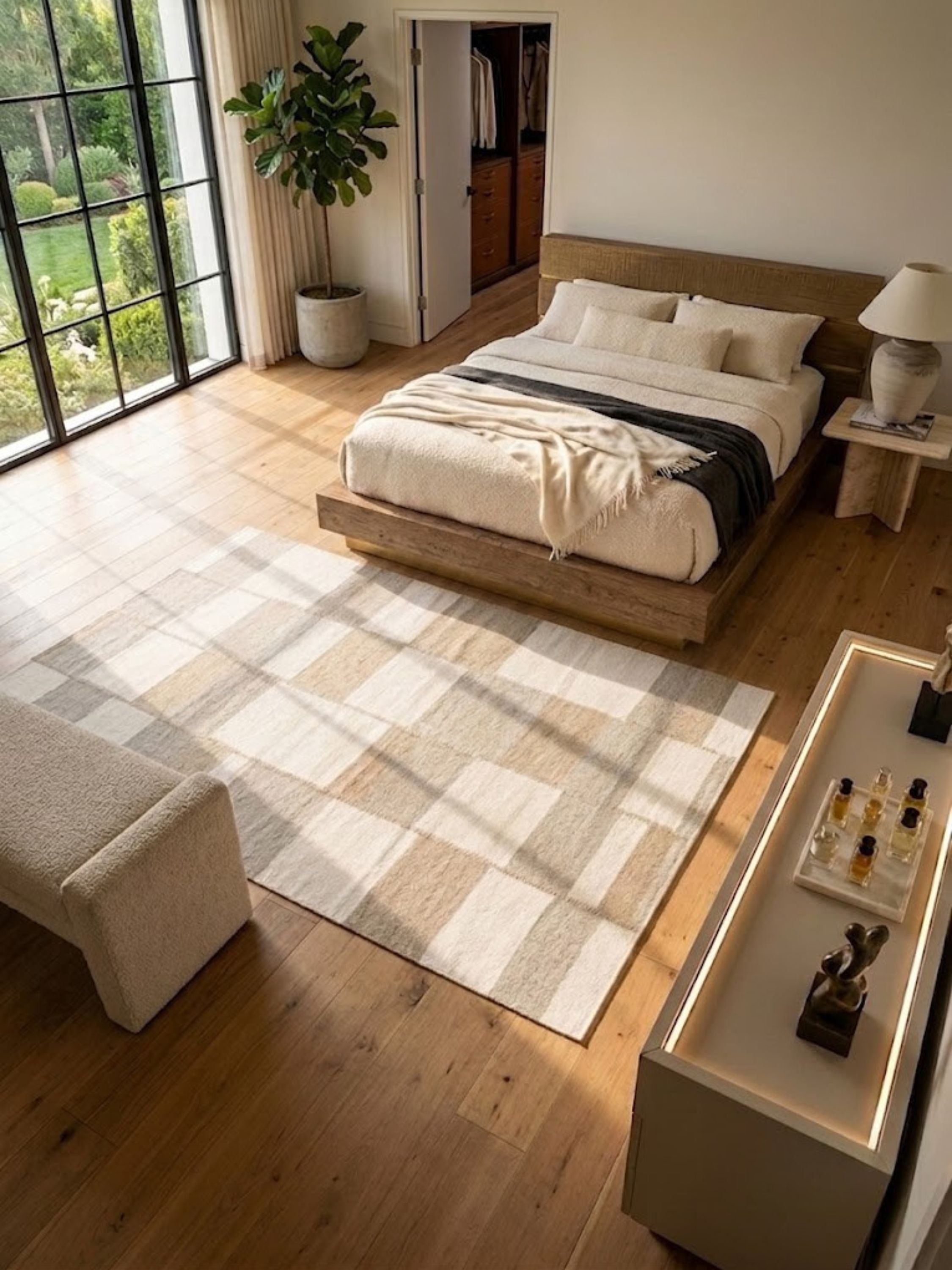 Wool rug with staggered tonal blocks, styled in a bedroom near the bed.